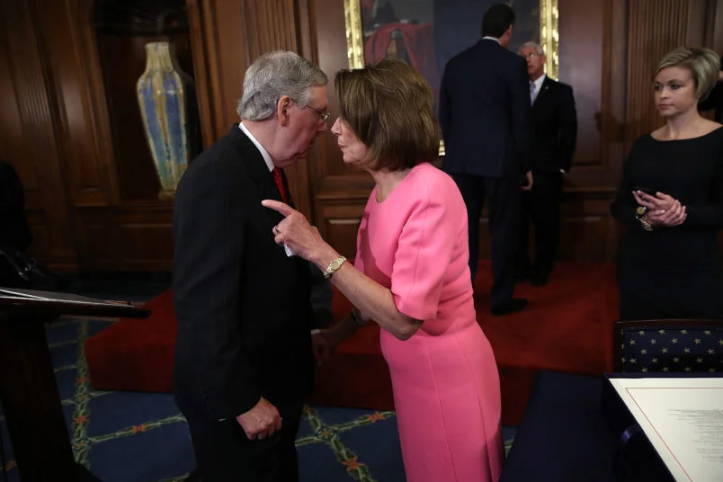 Nancy Pelosi and Mitch McConnell embracing in love and mutual sympathy on Capitol Hill