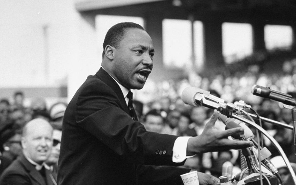 Martin Luther King Jr. at a speech in the 60s. King wrote extensively on the dialectically simple-though-complex nature of love in his book of sermons Strength to Love