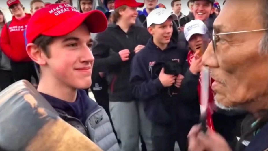 A Covington Catholic High School student is confronted by Native American Vietnam veteran Nathan Phillips outside the March for Life rally in DC this past Saturday