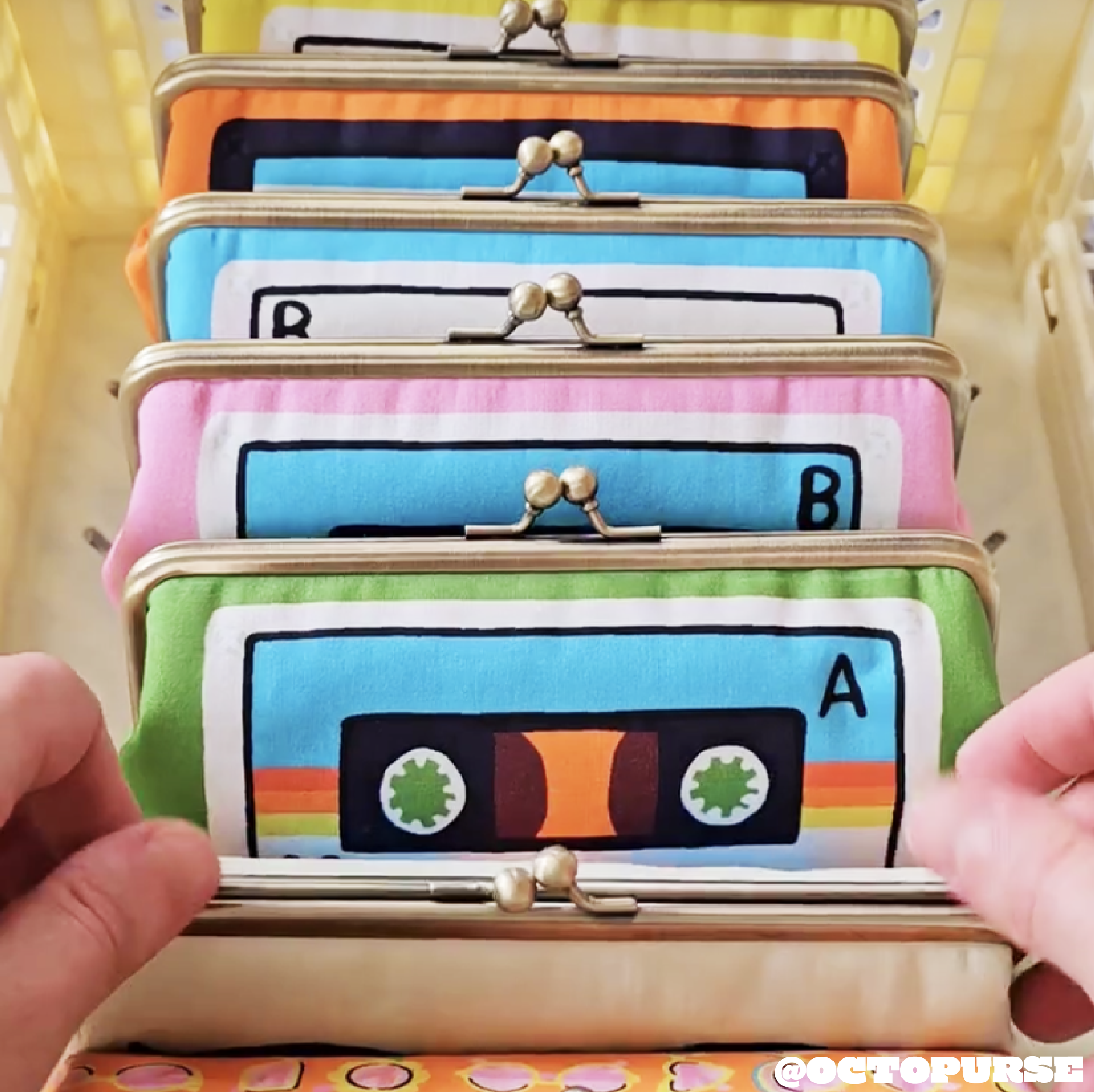 many cassette clasp purses in a row surface pattern designed by lysa flower purses made by @octopurse.png