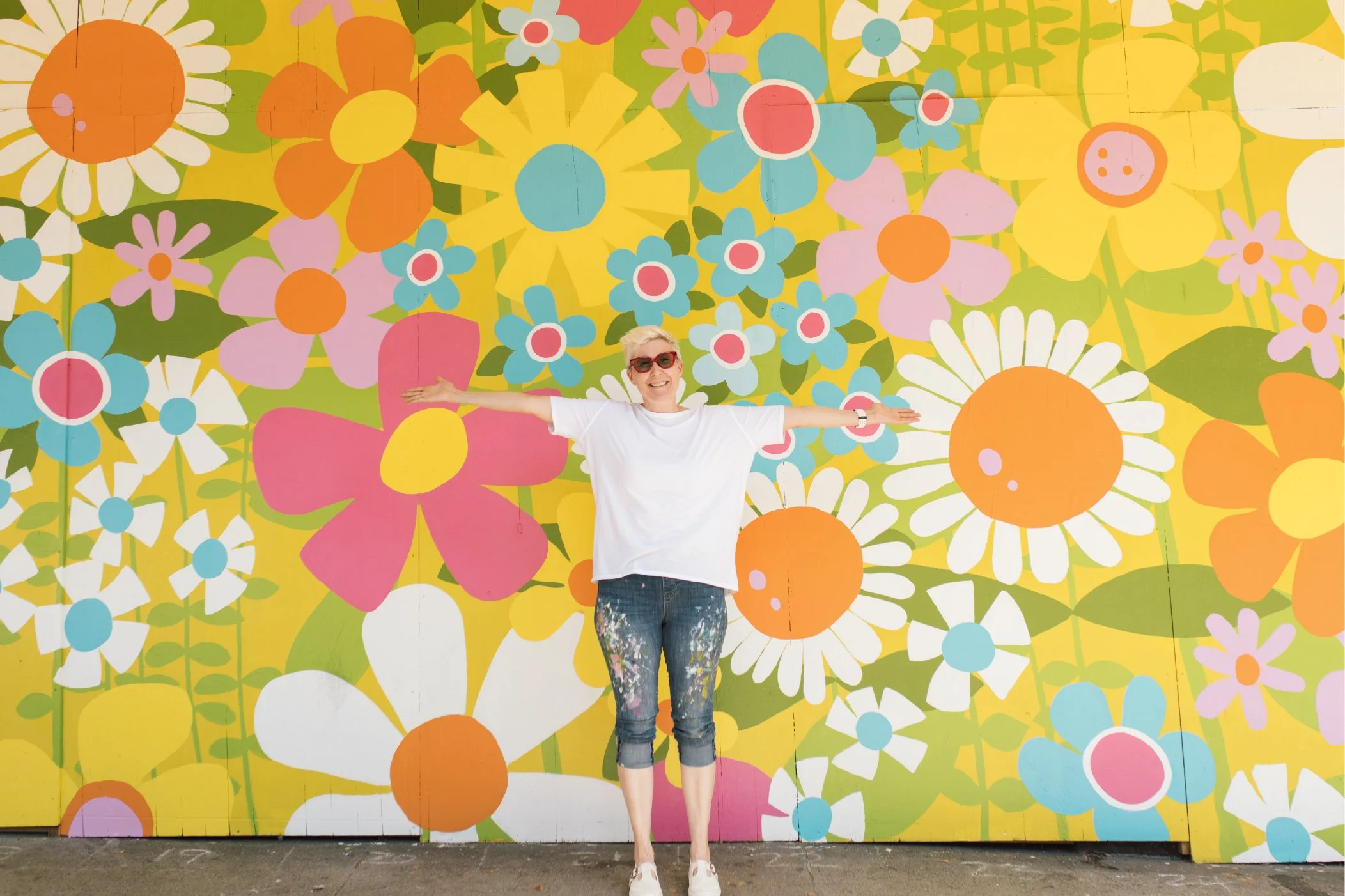 lysa flower standing infront of happy dressew mural vancouver.jpg