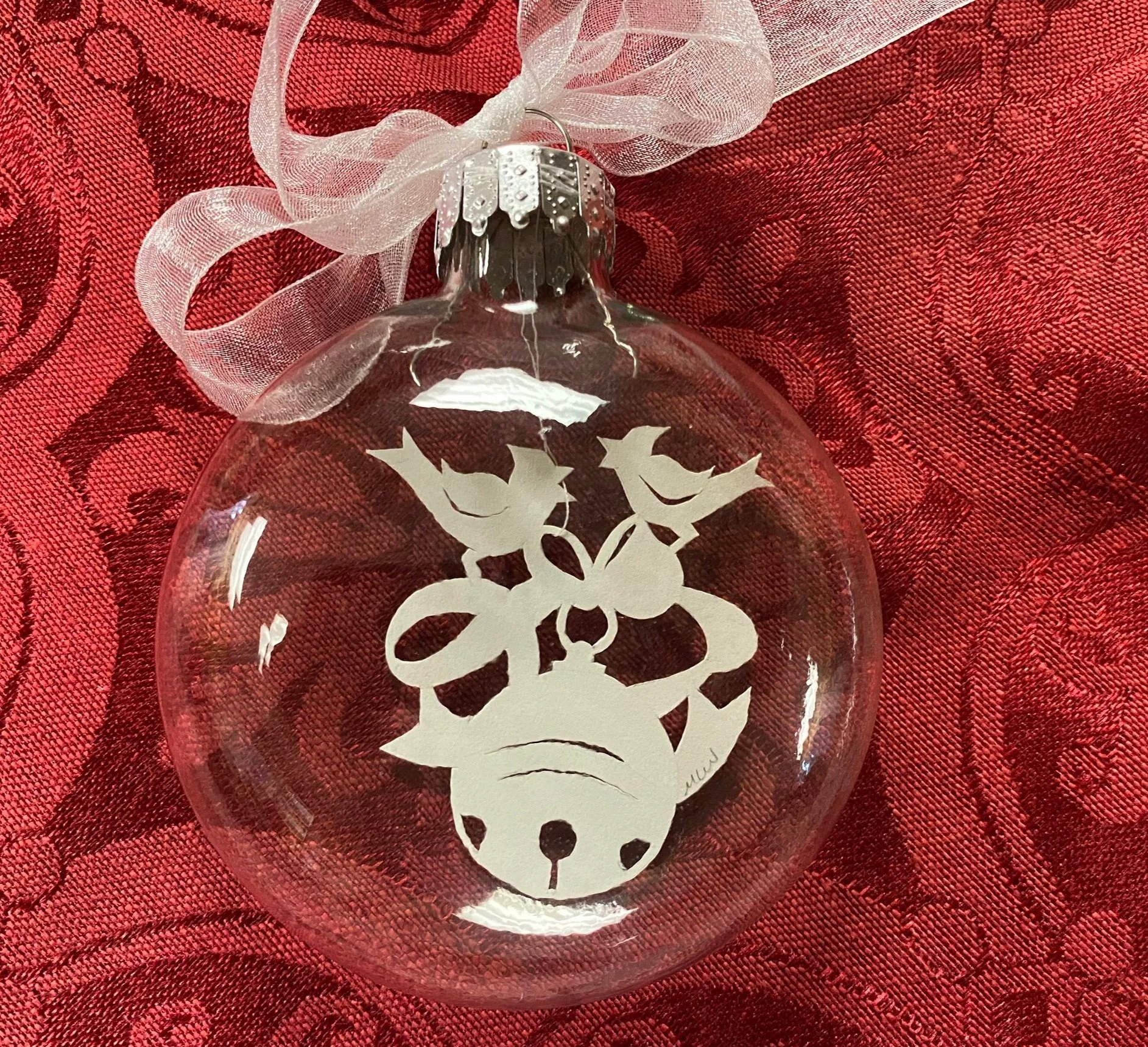 Two cardinals on a bell