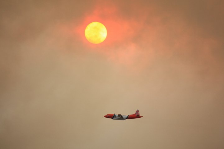 The Eerie sight of the sun tinted red from smoke. 