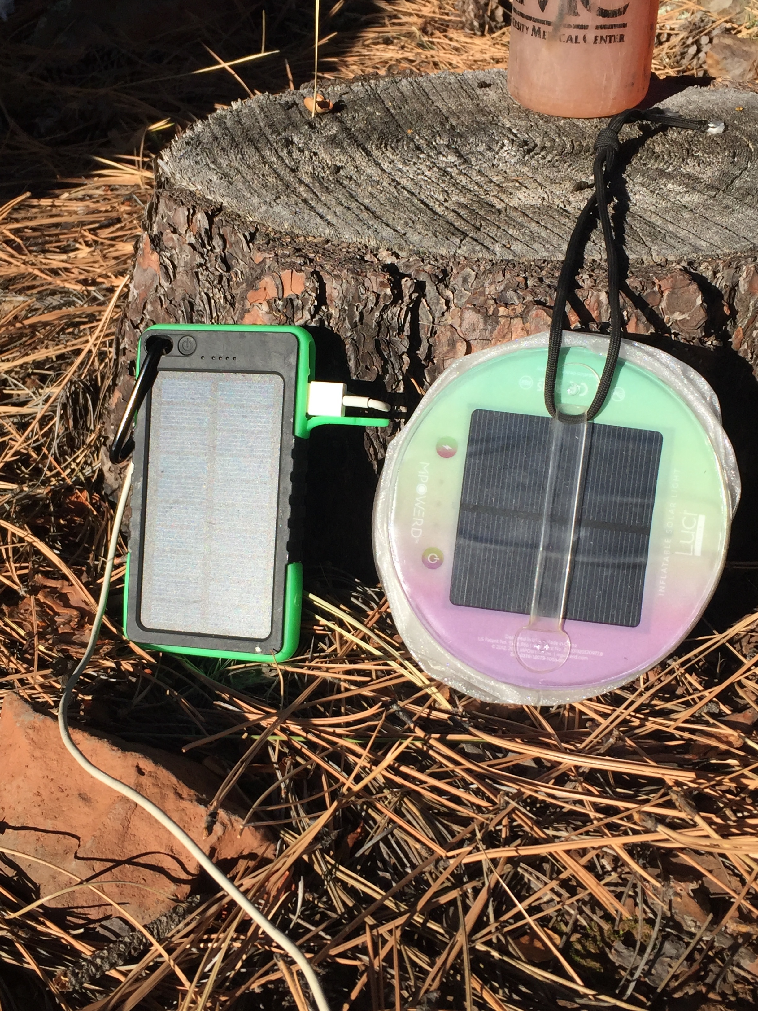 Last but not least, an up close of my solar power soaking up the sun. On the right is the previously mentioned Luci Light . On the left is the phone charger I was carrying that fell off. (Dang it!) It can be charged from a plug at home to carry extra power for your phone and is then supposed to recharge from the sun. I can attest to the fact that is will indeed charge from the wall, and hold a charge to refuel your phone. Because it fell off and got lost, I can't attest to how well the solar part works. If you want to try one yourself, it was very inexpensive. I had one similar to THIS . I'm hoping for a new one for Christmas and once I test out the solar functioning, I'll let you know. For the price though, even if the solar part isn't perfect, it is worth it for the bonus battery pack aspect. 