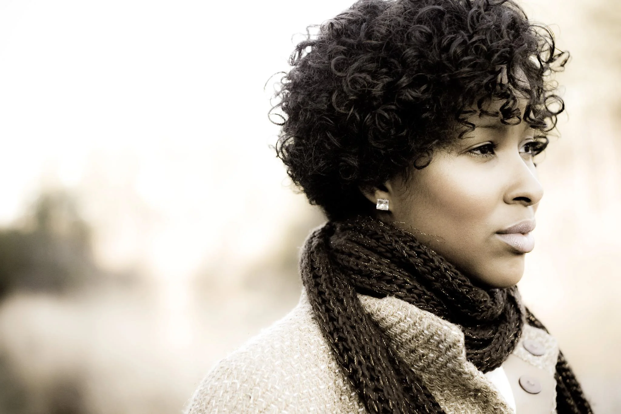 The layers of Siobahn's coat and the texture of her scarf give this image added depth and dimension. Interest and detail are maintained despite the neutral color palette. Photo By Nikia Williams
