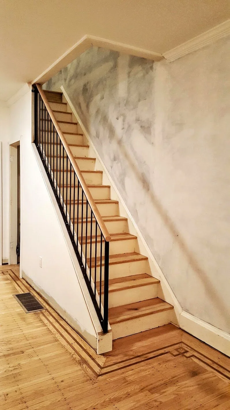 Steel railing with red oak top rail cap