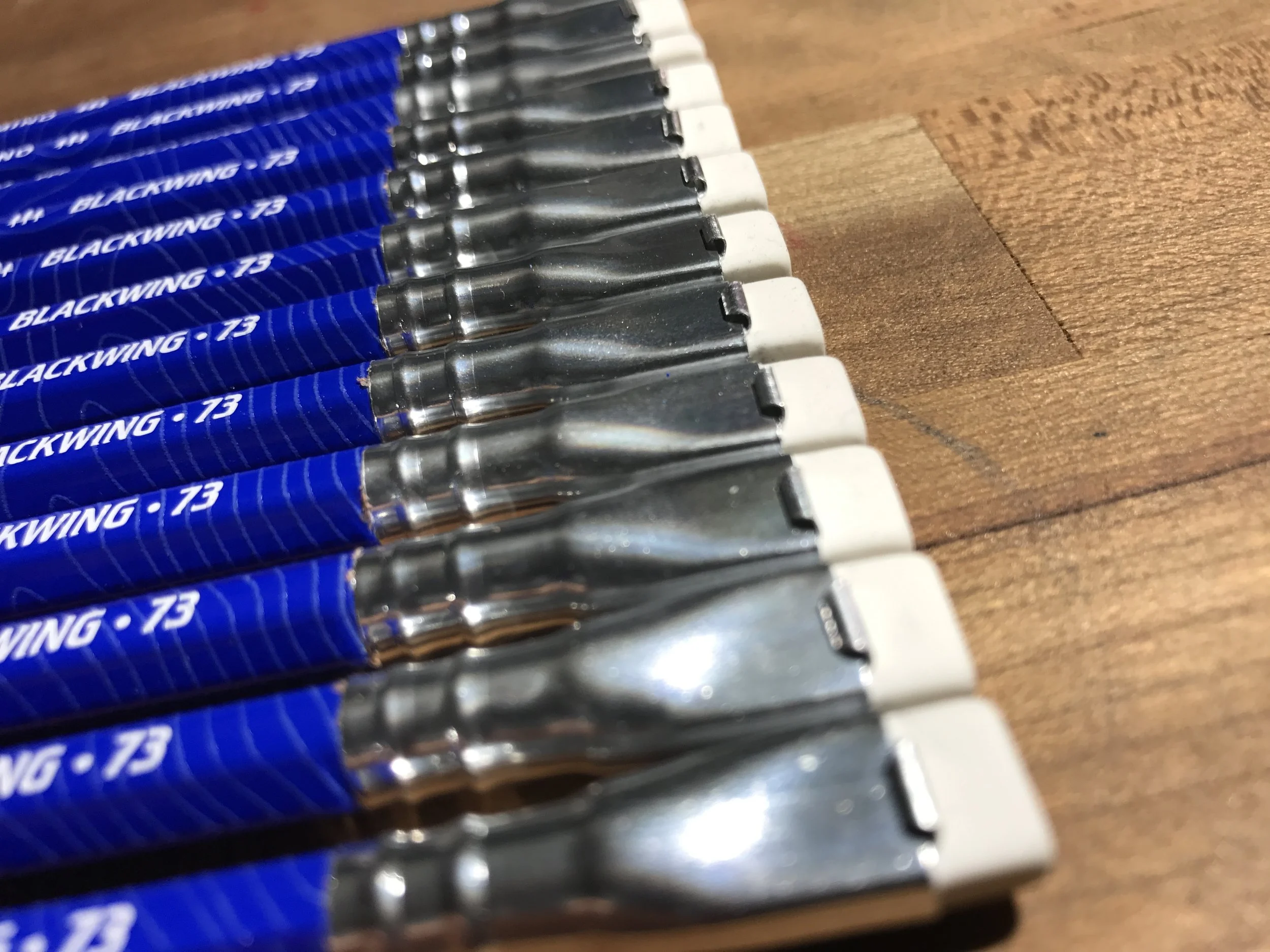 Silver ferrules, white erasers.
