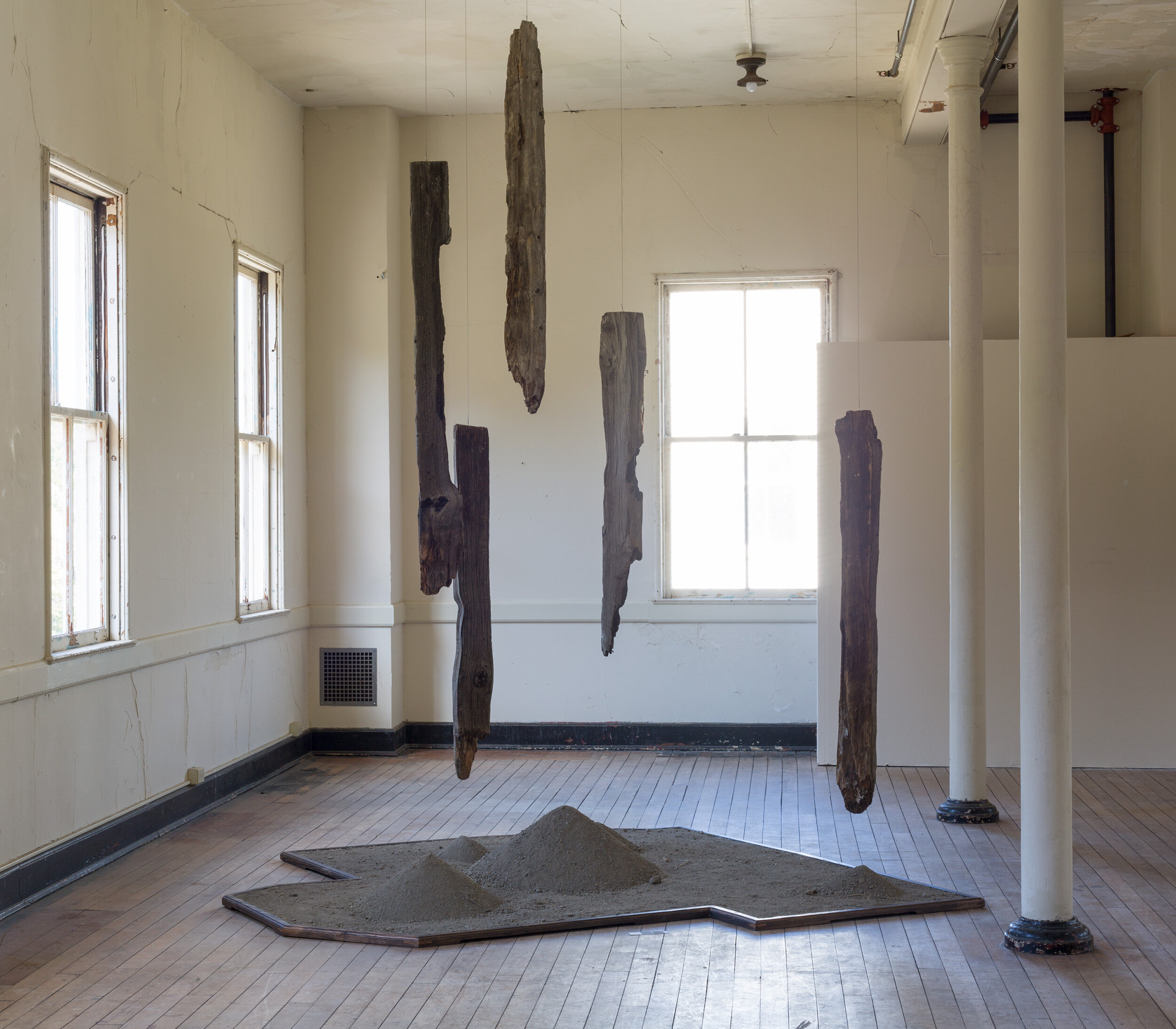   Mark Baugh-Sasaki, Uprooted Fence posts and earth from Tulelake Segregation Center, and steel cable 120" x 96" x 84" 2018      