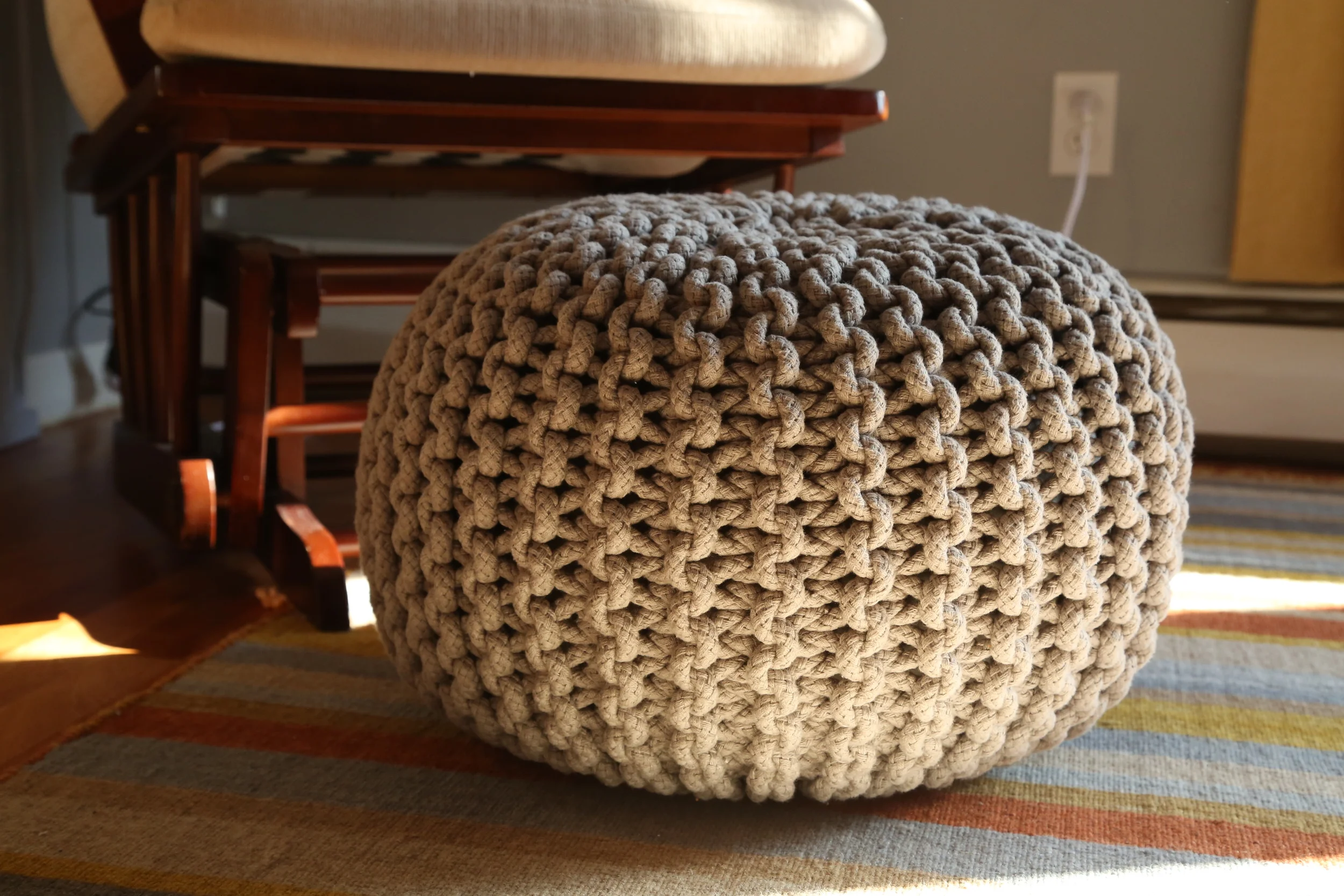 I needed a place to prop my feet for nursing, but the gliding ottoman that came with the chair was getting dangerous with my climbers around. This knitted pouf was the perfect solution. You can get cute ones at Land of Nod, but I found this one for half the price on Amazon.