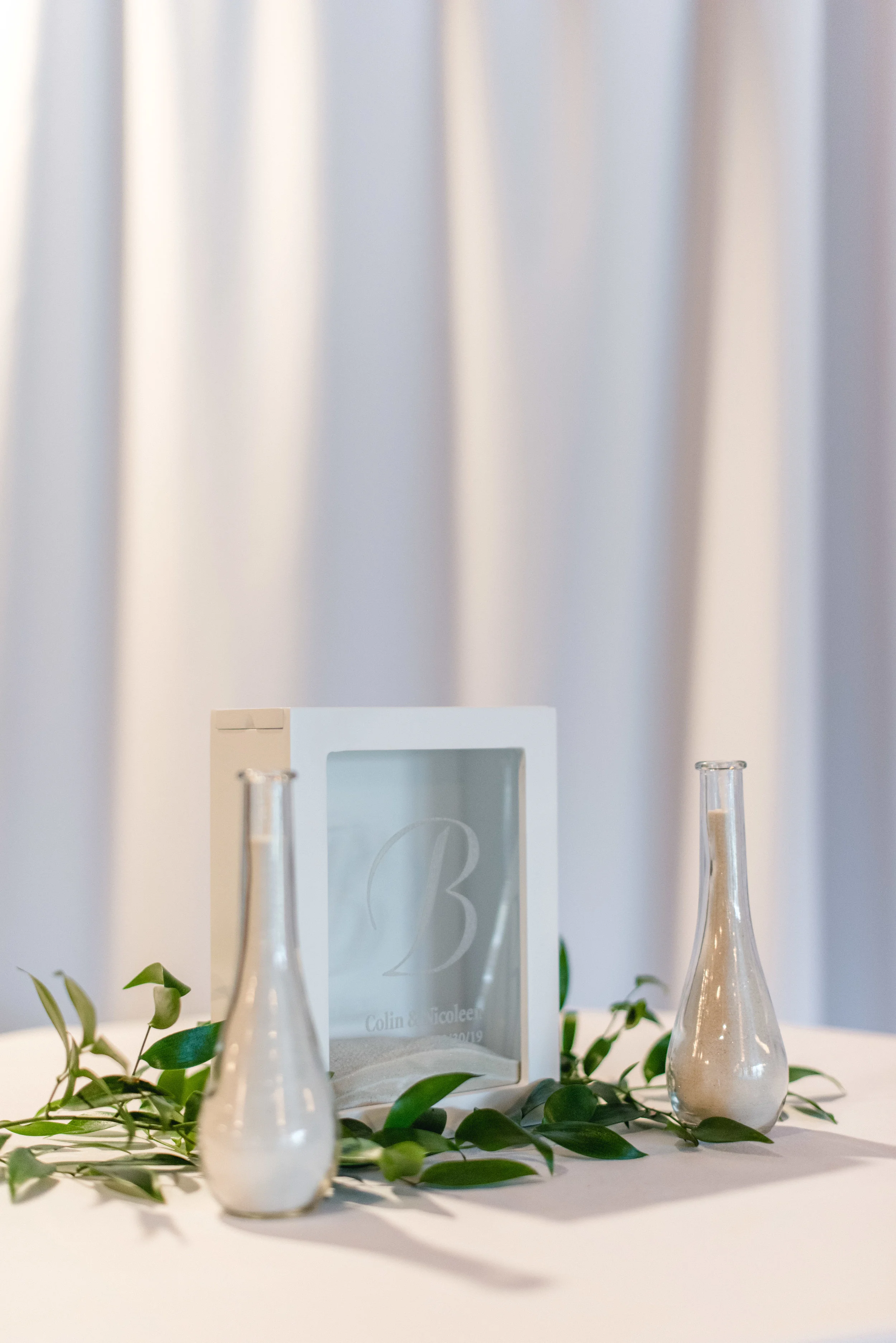 ceremony sand with greens.jpg