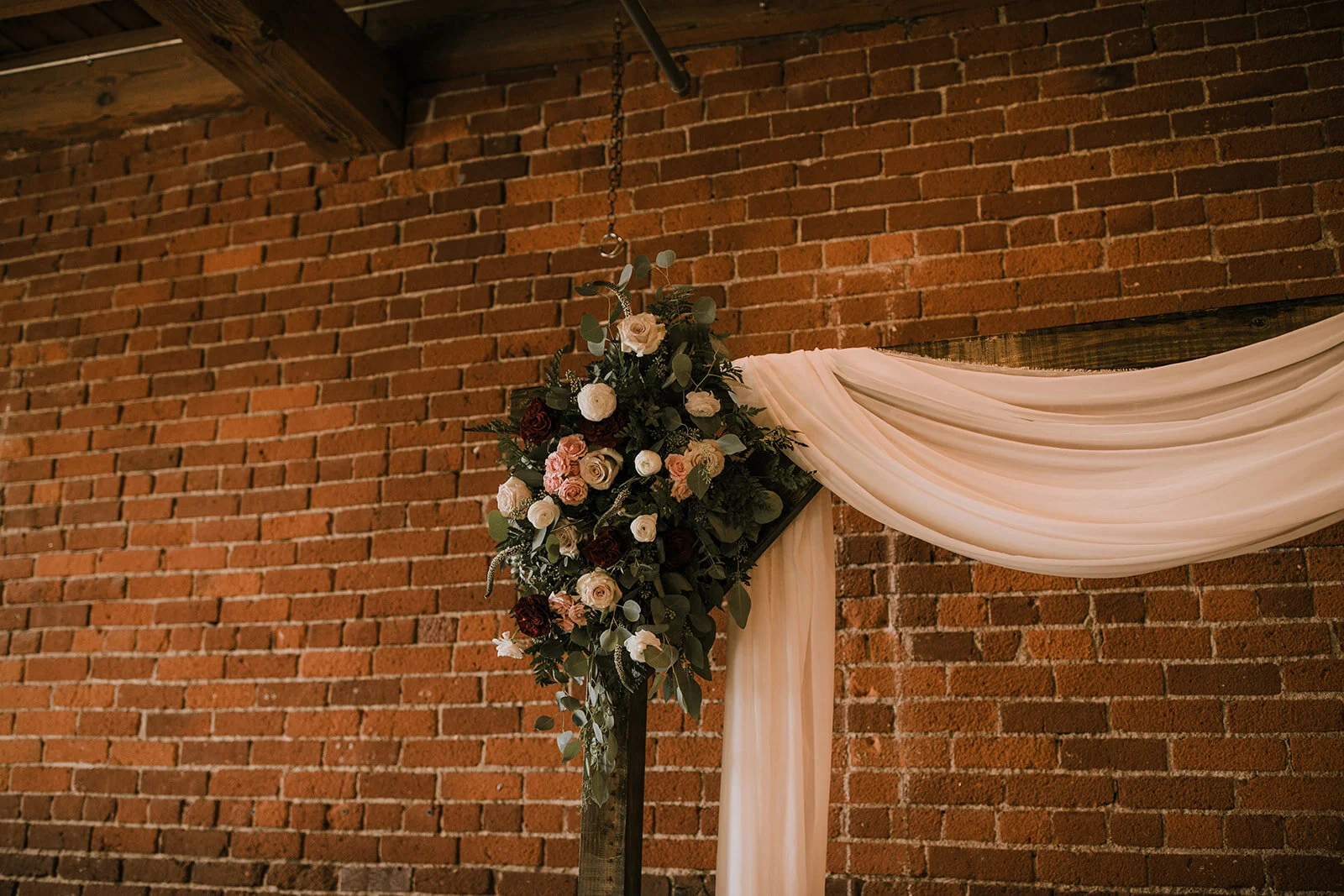 closeup arbor flowers muave red blush draping.JPG