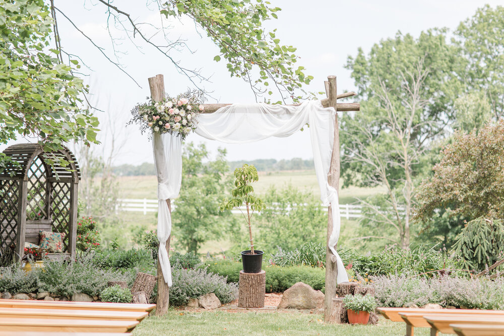 arbor flowers outside wedding.jpg