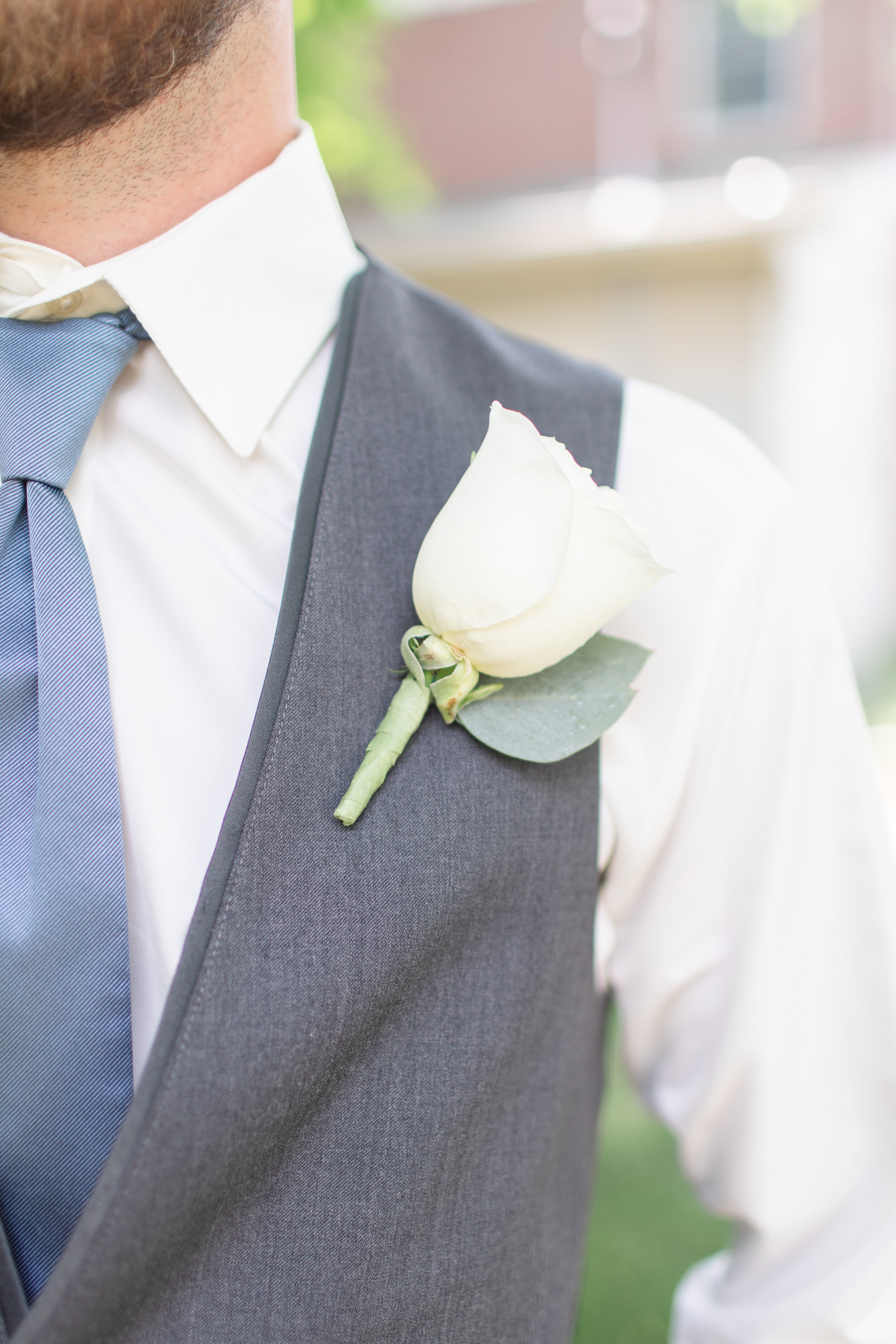 white rose boutonniere with eucalyptus .jpg