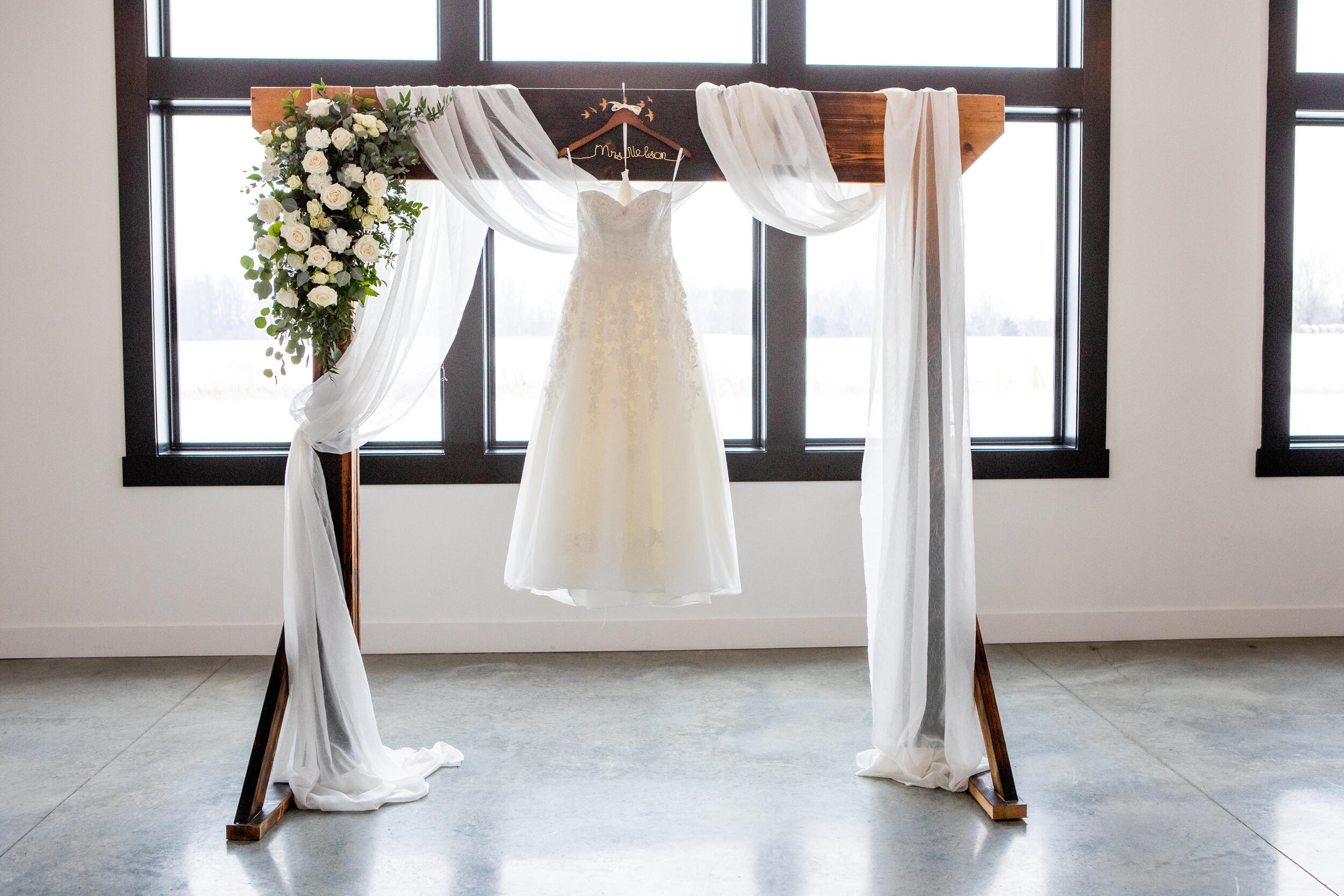 White Florals on wedding arch.jpg