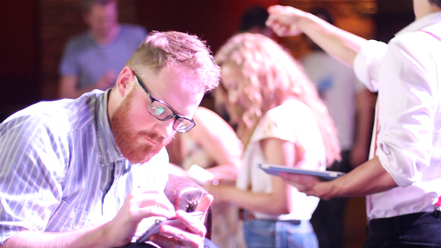 Andrew Rae in front of the crowd drawing