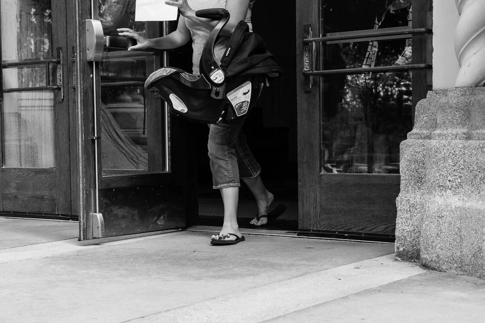 A woman and child leaving the Spokane County Courthouse. 