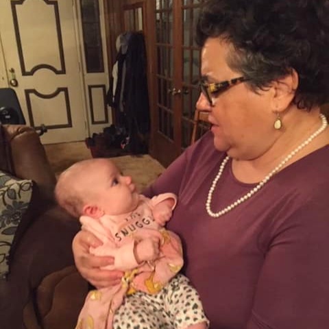 My mother, Laurie, holding my daughter, Amelia.