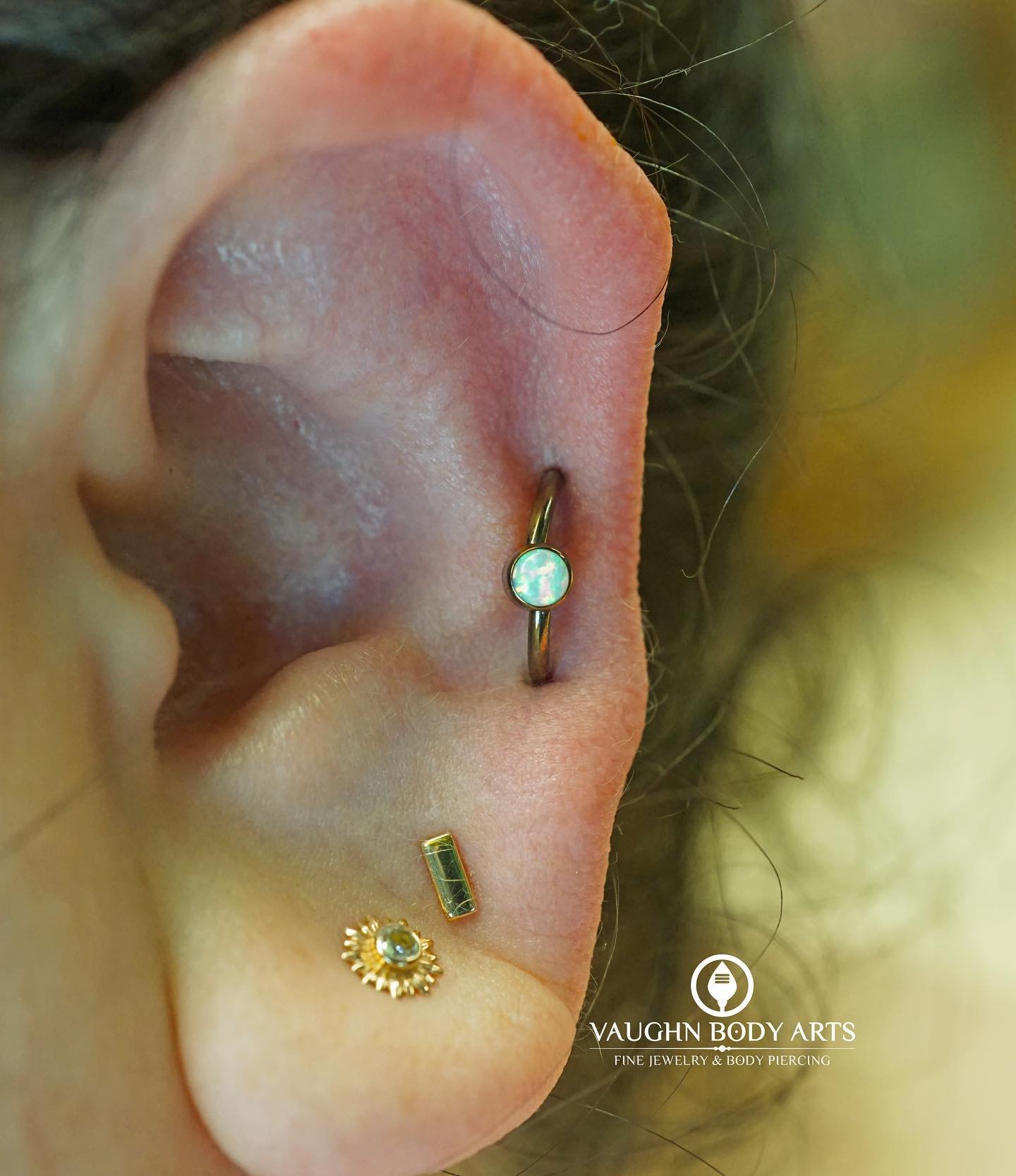 Here&rsquo;s a super fun orbital piercing we got to do for our awesome client Tracy last month. 

We anodized a niobium captive bead ring into a bronzy color with a bezel set white opal. 

Thank you so much Tracy, this looks so awesome on you! 

#vau