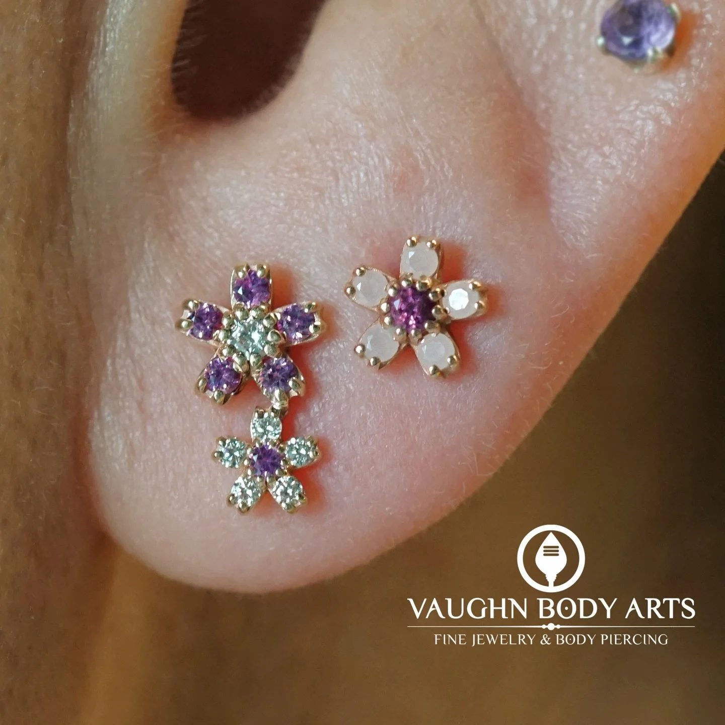 This lovely ear belongs to our wonderful client Chan. 

Chan had us order her a pair of the new &ldquo;Mini Cherry Blossom Clusters&rdquo; from BVLA for her lobes.

She picked out this stunning combination of genuine Pink Sapphires and Diamonds set i