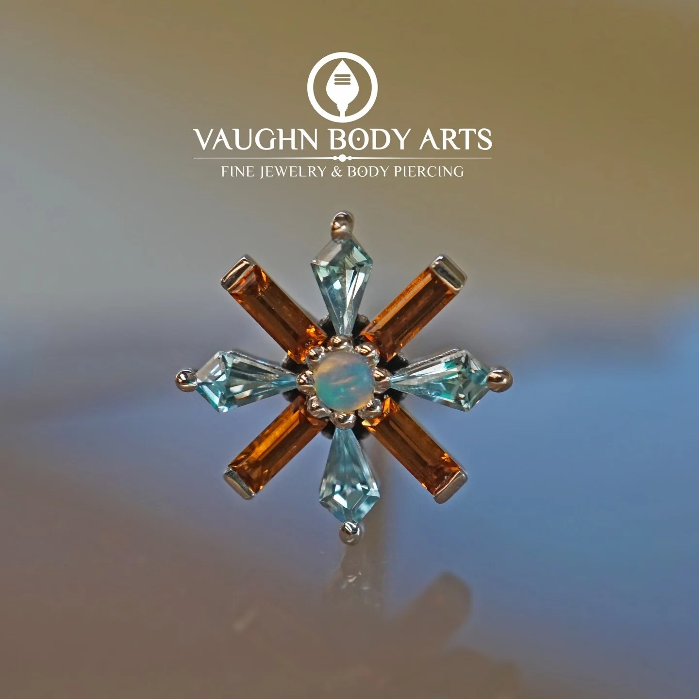 Our wonderful client Carolyn had us order her this &ldquo;Akira&rdquo; end from BVLA.

Here it is in her new faux-rook piercing! We absolutely love this gemstone combination she came up with. Swiss Blue Topaz, Madeira Citrine, and genuine Opal set in