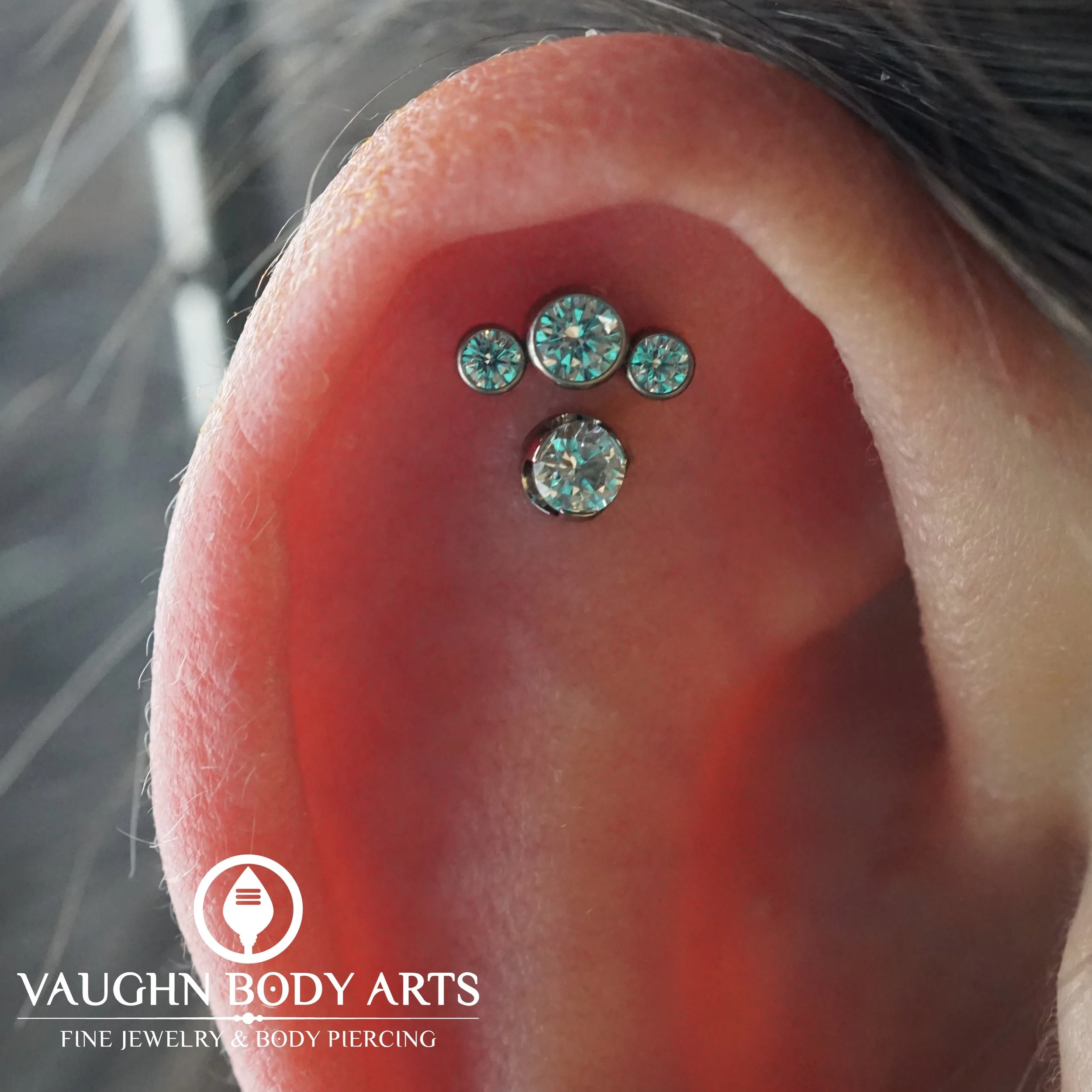 We love how these helix piercings turned out for Julieanna. 

She knew exactly how she wanted the placement to look, and you can never go wrong with the classic looks of clear gems set in titanium. 

Thanks so much for letting us do these fun piercin