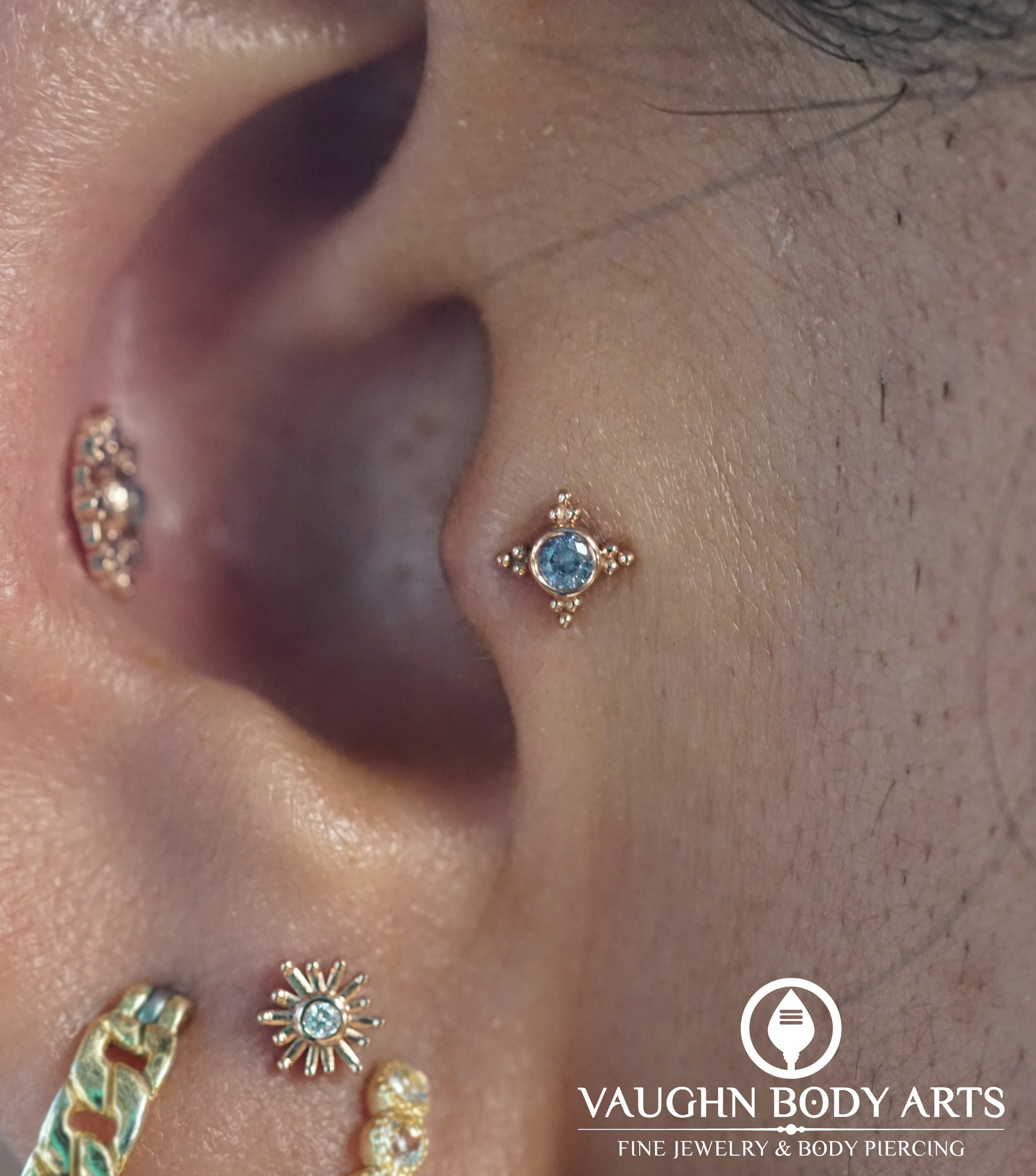 A lovely new tragus piercing Vaughn got to do for Julie. 

Julie picked out this super cute Mini Kandy from BVLA. It looks especially nice next to her new stacked lobe piercings he did a few days before. 

Rose gold with Tanzanite is one of our absol