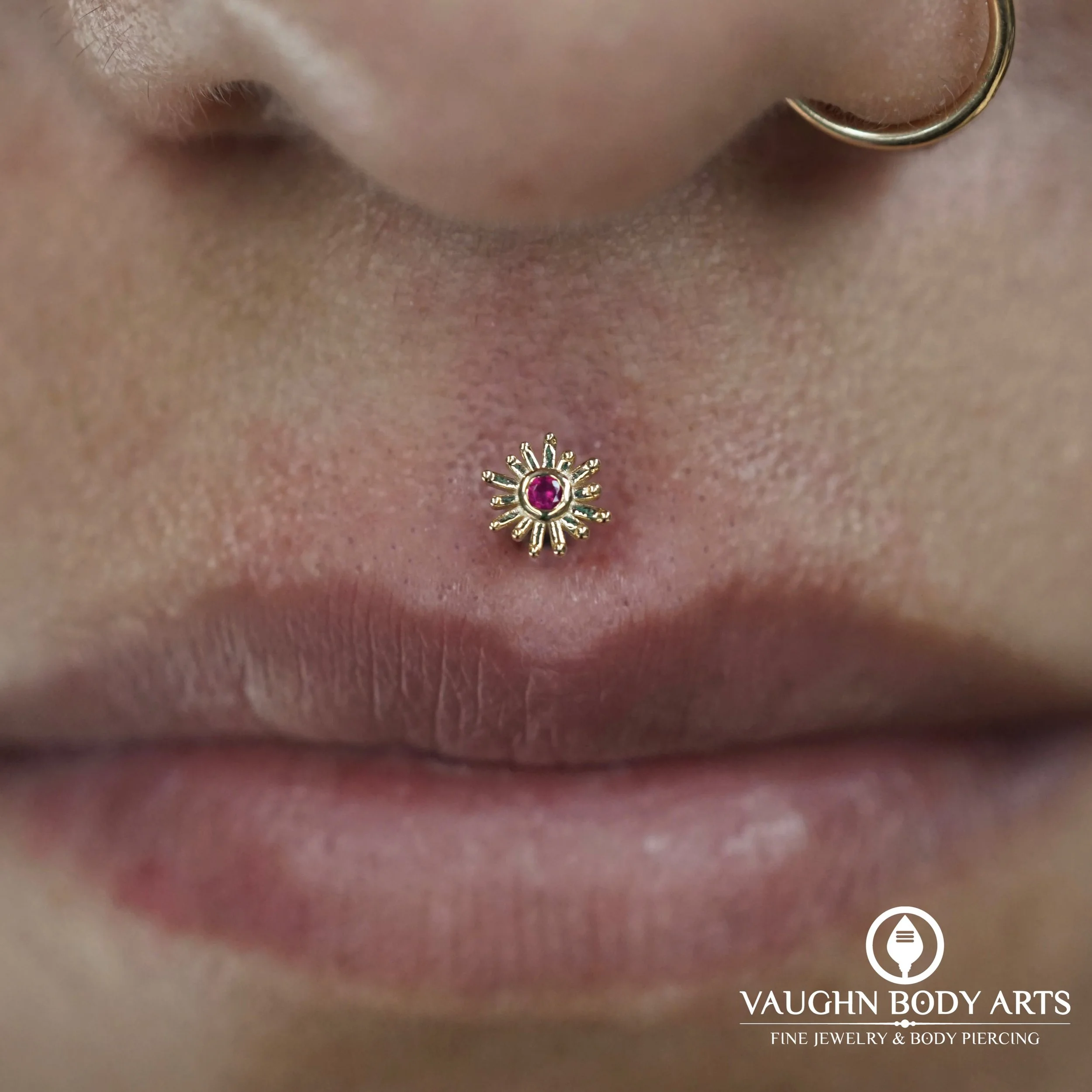 A super pretty philtrum piercing Vaughn got to do for Mayra. 

Pictured here freshly done with a longer flatback to accommodate for the initial swelling. 

Mayra chose a lovely Sunray from BVLA made of solid yellow gold with a genuine Ruby. 

Thank y