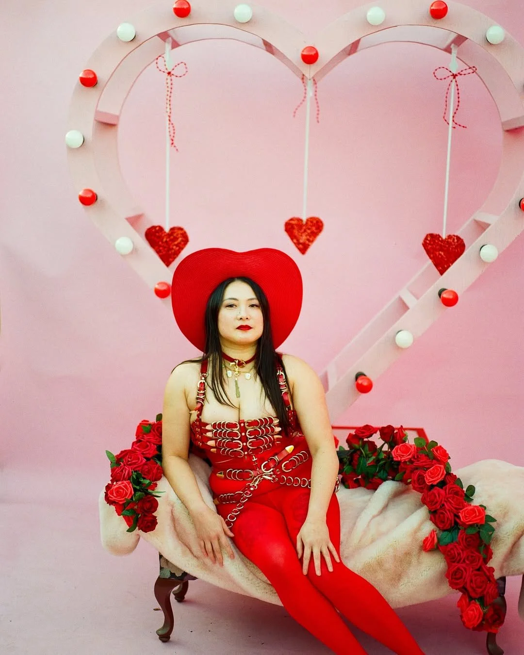 a valentines day portrait of an asian model wearing red lipstick 