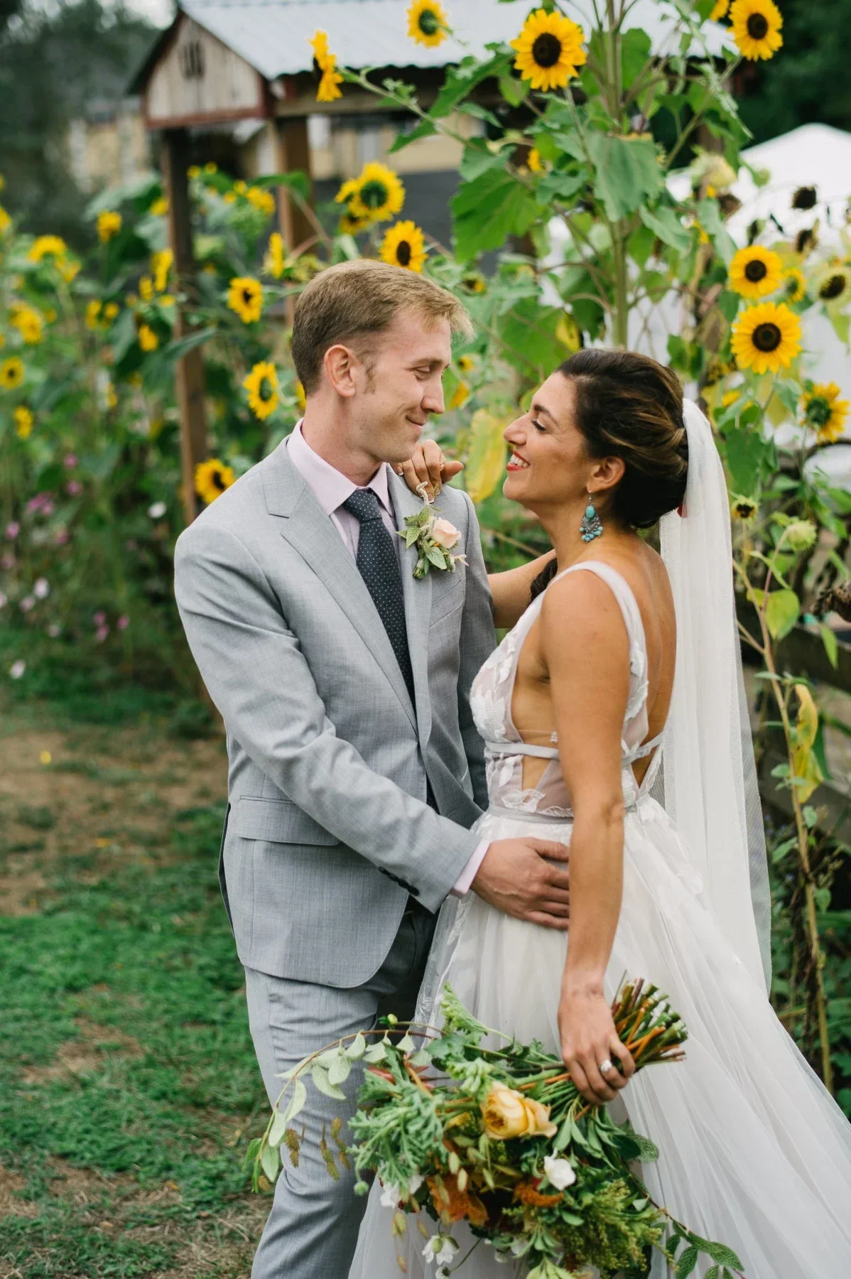 A bride with red lipstick and groom at Pendarvis Farm outside of Portland, Oregon