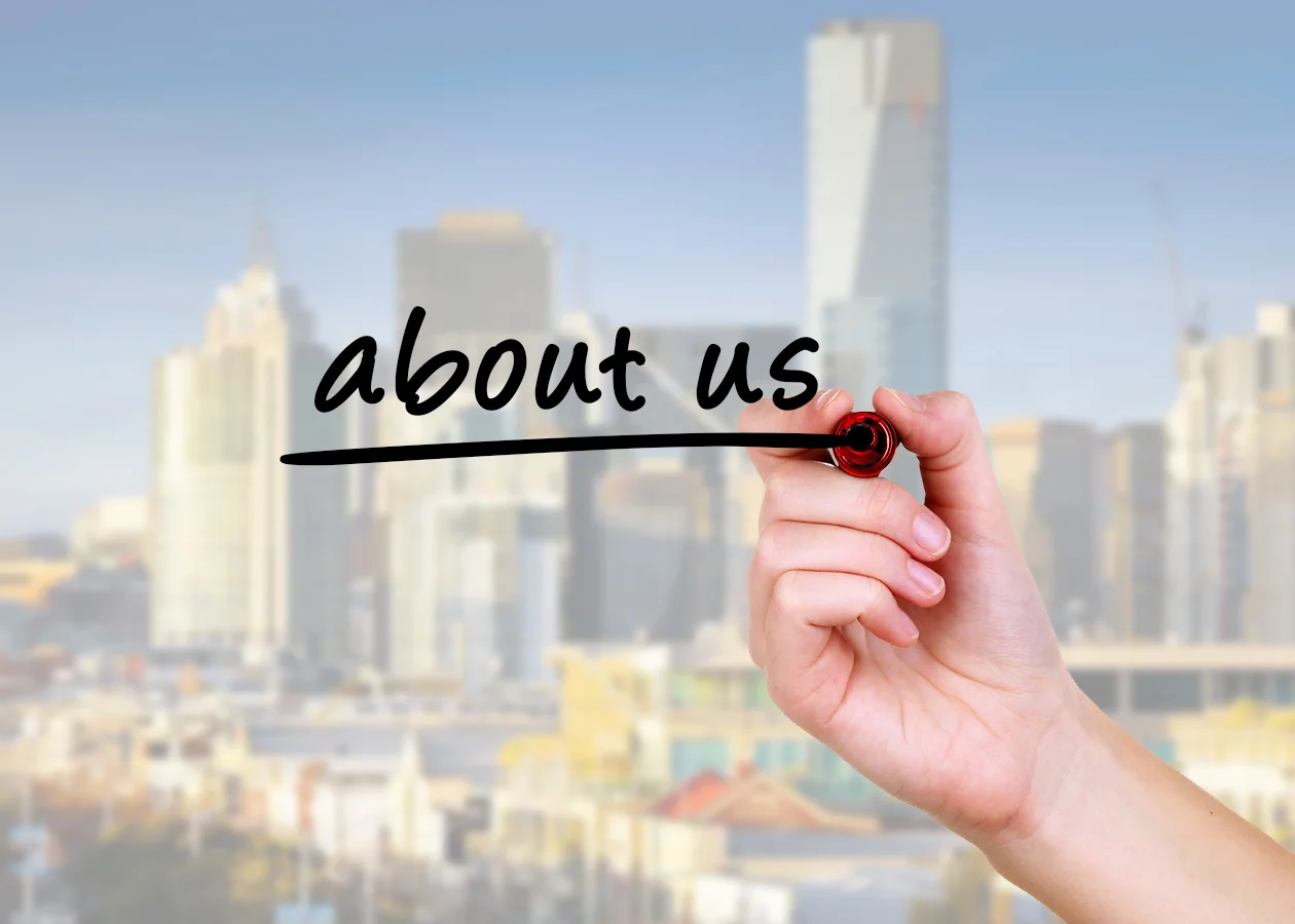 about us hand and pen.jpeg