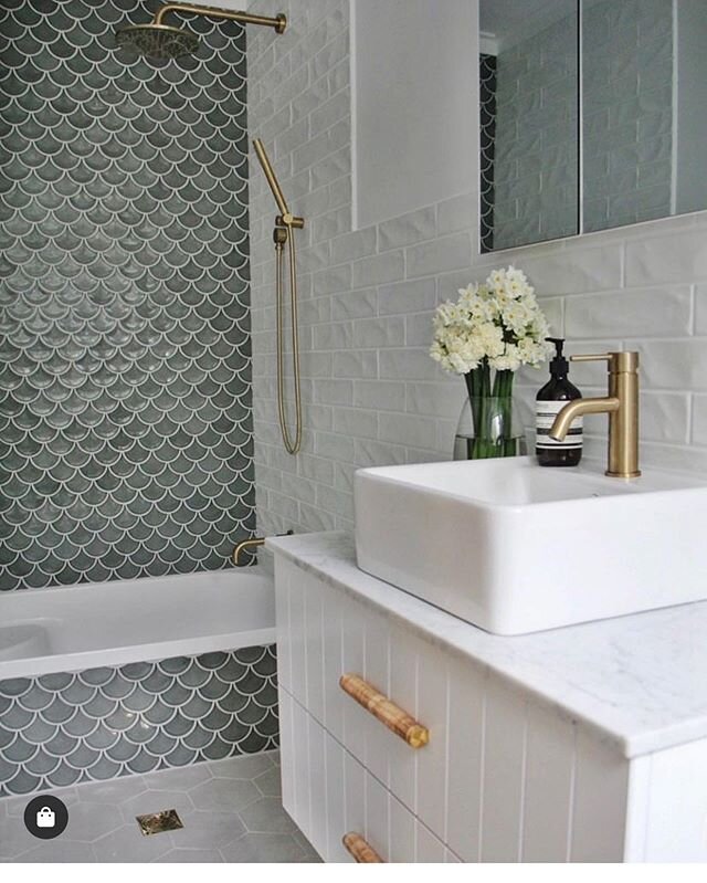 They win with their tile designs! Used on bathroom wall and floors here.

How gorgeous are these?
