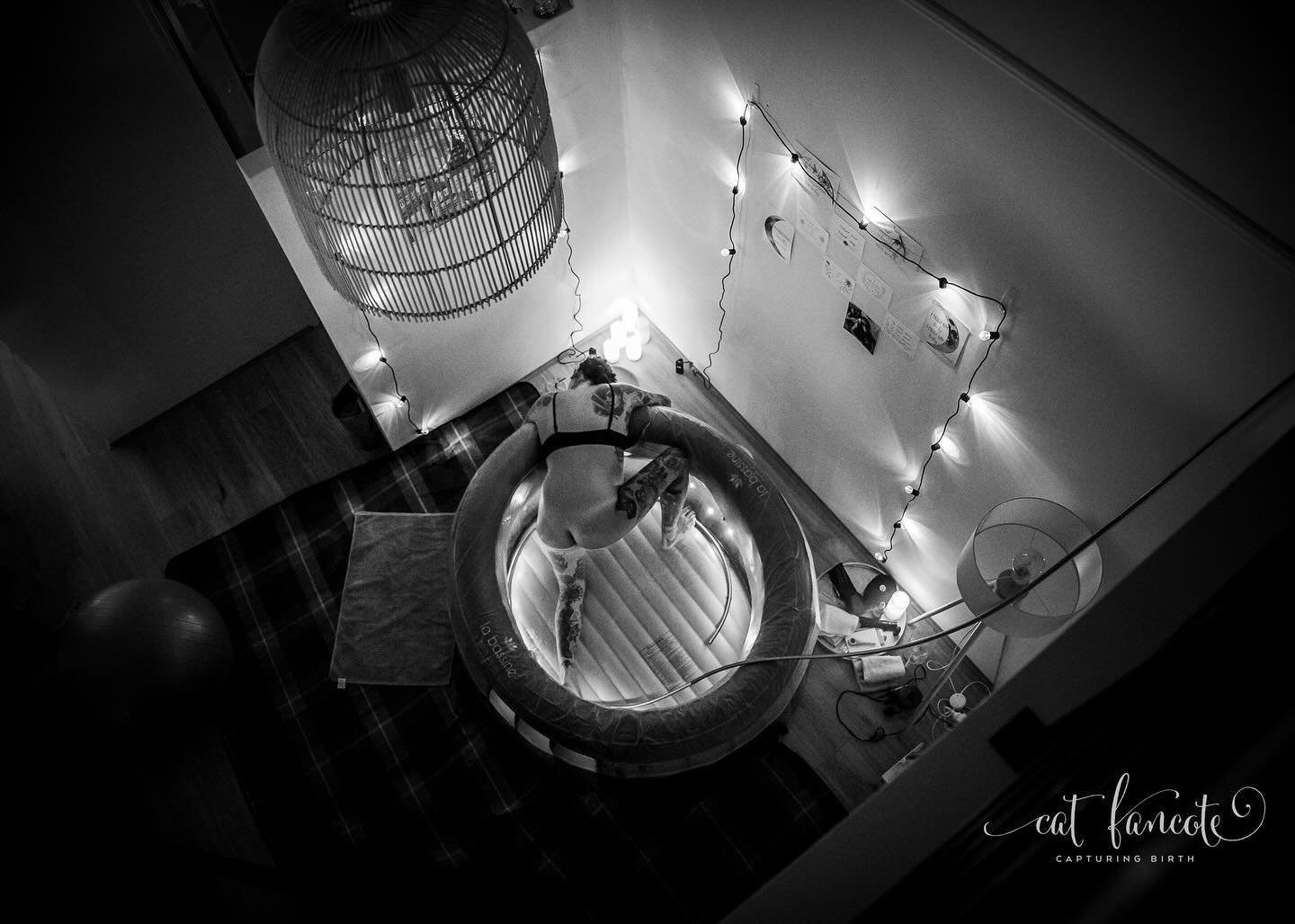Peering down, capturing a glimpse of her labouring quietly, as though I was peering through the portal into a parallel universe.

A universe where it was just her and her baby working together in unison. Dancing the birth dance. Guiding each other fo