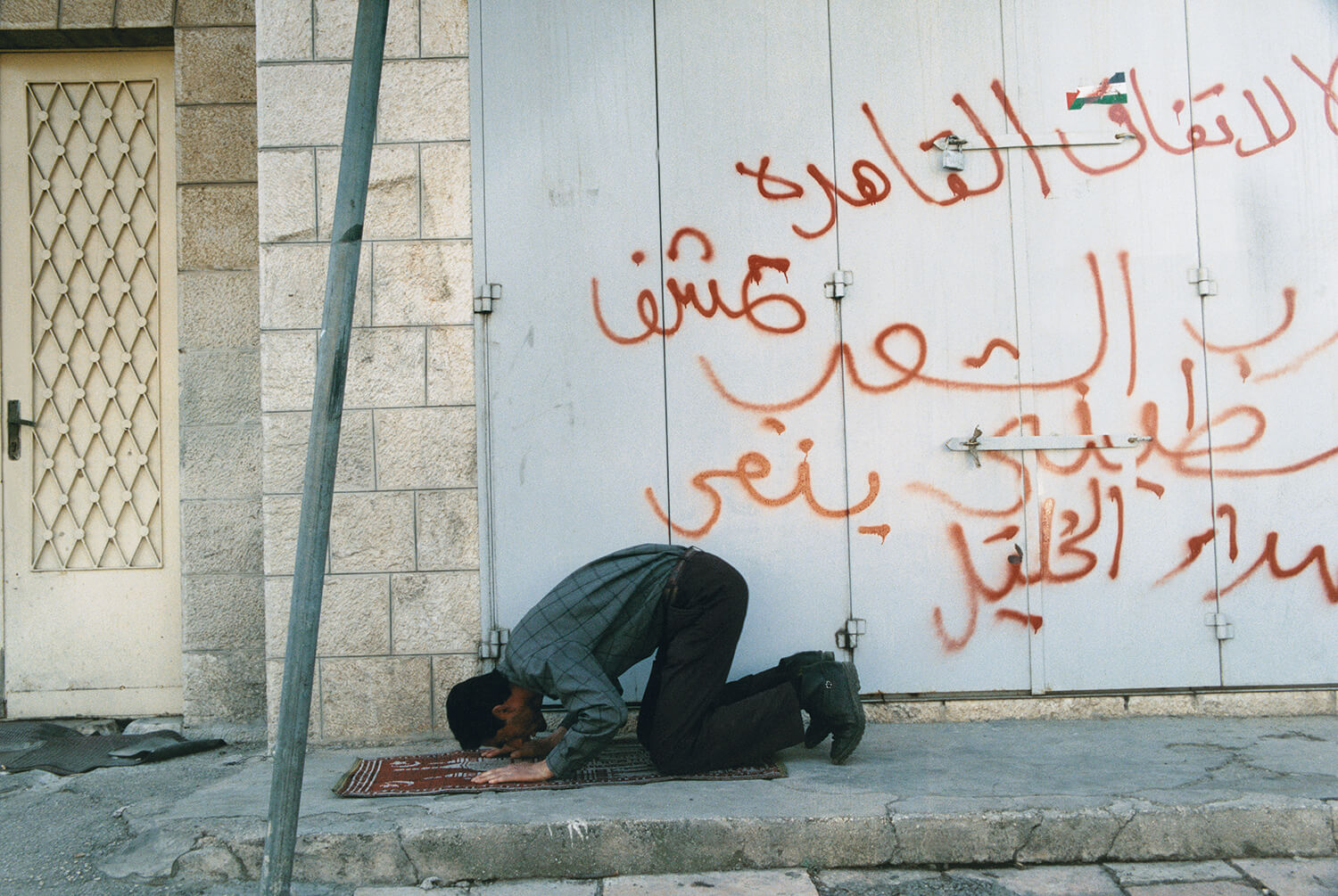  Muslim in prayer on a street in east Jerusalem. 
