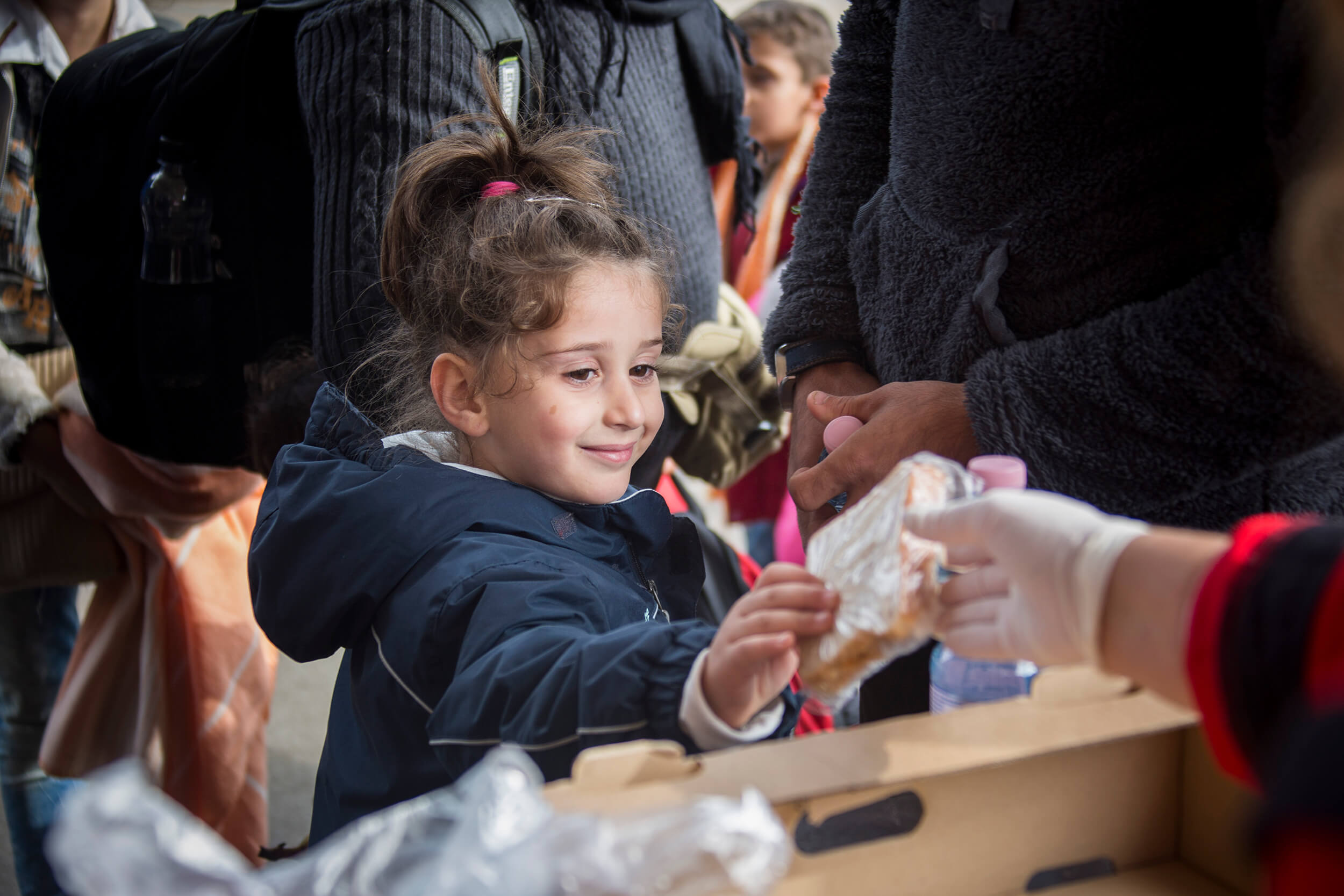  Hungaria. October 2015. Refugees from Syria, Afghanistan and Iraq arrive by train to the Hungarian border station Hegyeshalom. The Red Cross distribute food, water, clothes, shoes and other necessities. 