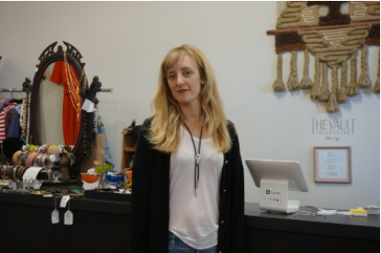 Ruth Meteer, the store manager in front of the main desk at The Vault