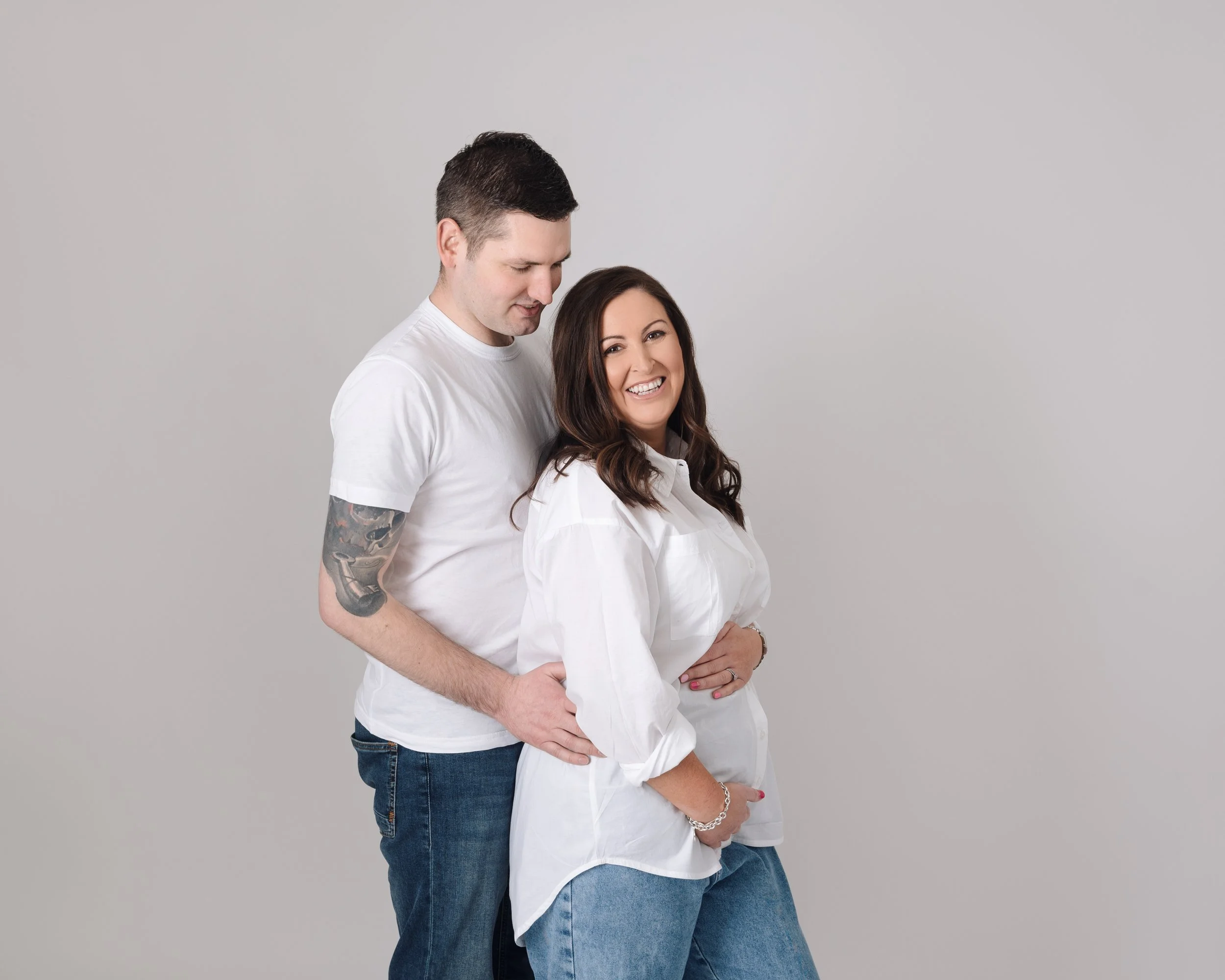 Contemporary couples portraits during a gender reveal photography session