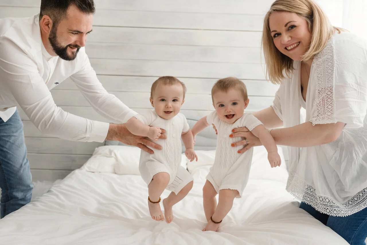 Parents with baby twins during Milestone session at Kingshill Studios.jpg
