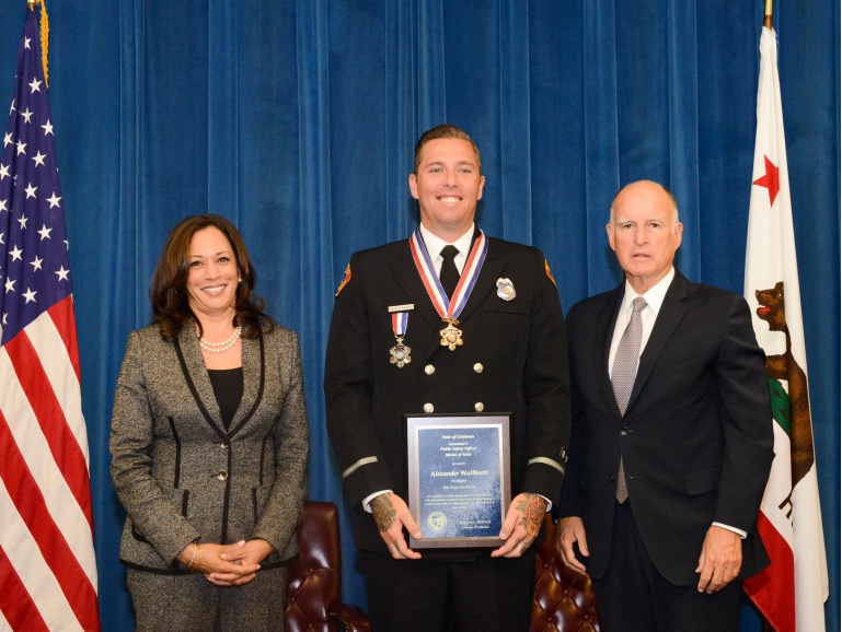 Governor Brown and Attorney General Harris with San Diego Fire-Rescue Department Firefighter Alexander Wallbrett. Photo Credit: Dionne Grubbs, California Department of Justice.