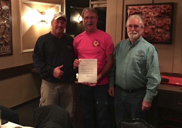 Marin Professional Firefighters President Bob Briare (center) presents Local 1775 affiliation letter to Tiburon shop stewards Bob Brooks and Scott Urban