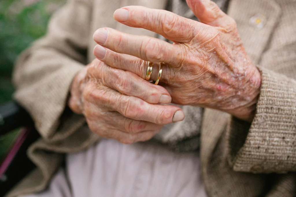 Grandpa plays with his and his beloved Ruth's wedding bands. 