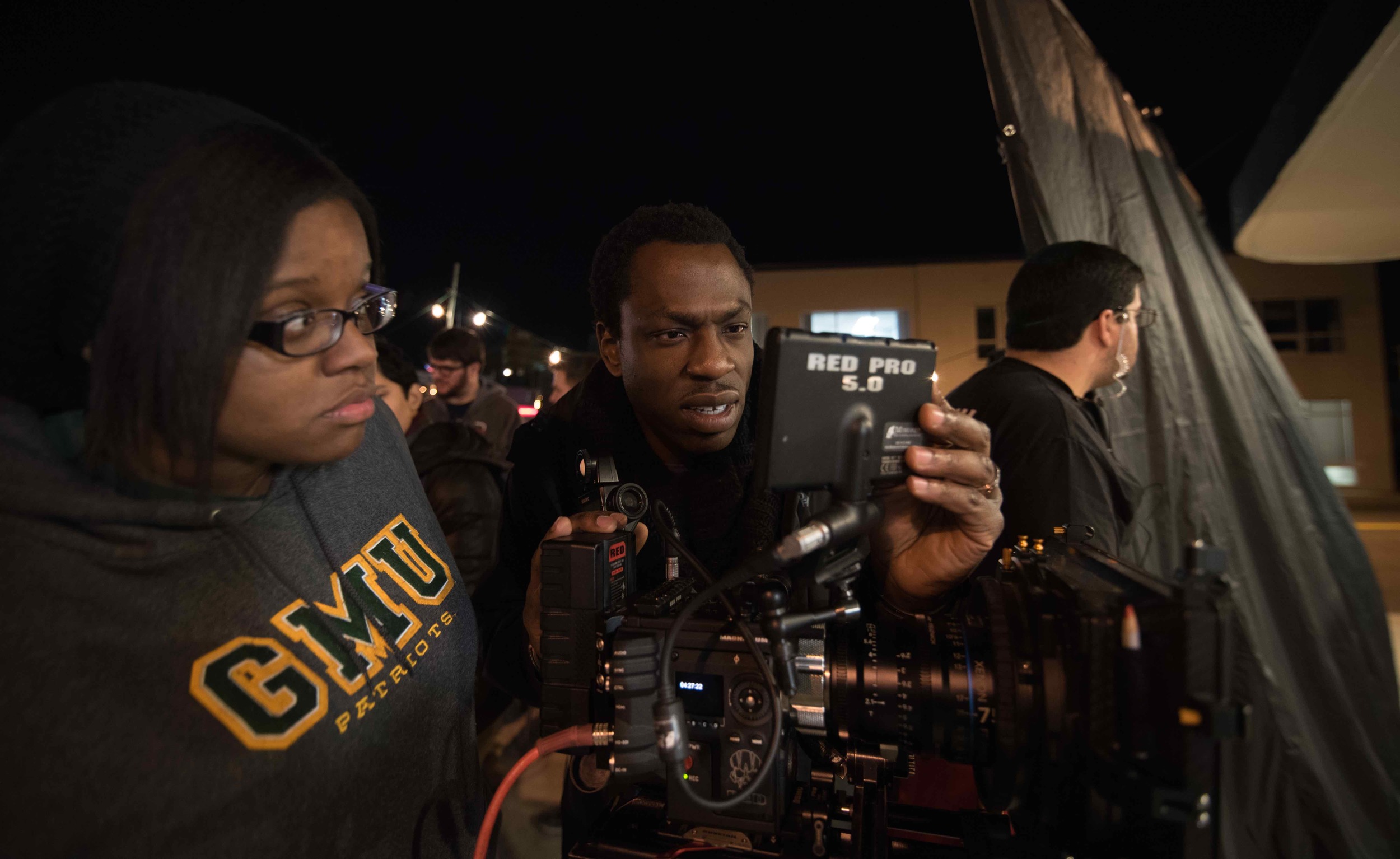  Cinematography student D'Andra Walsh and Cinematographer Hans Charles setting up the first shot in JAVA the short. Image by Dixie D. Vereen. 