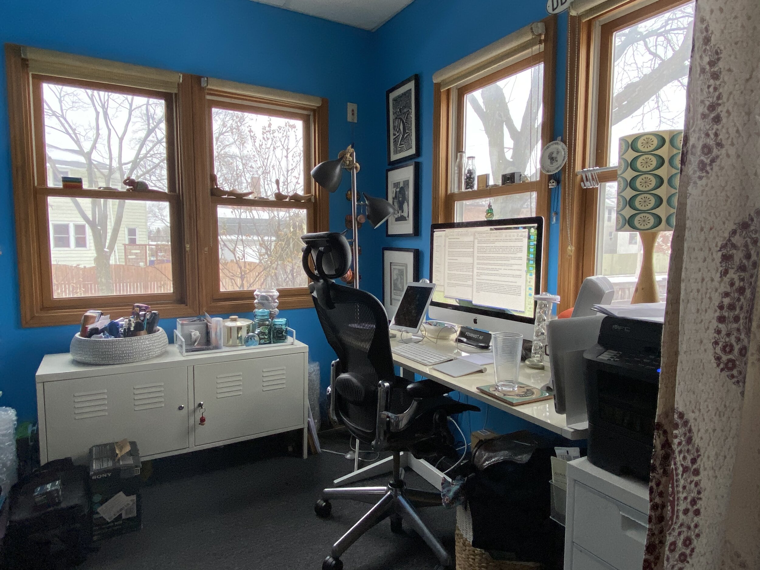 Image by Shayna Connelly of DePaul University of her home office in her insulated back porch with a newly installed curtained partition.jpeg