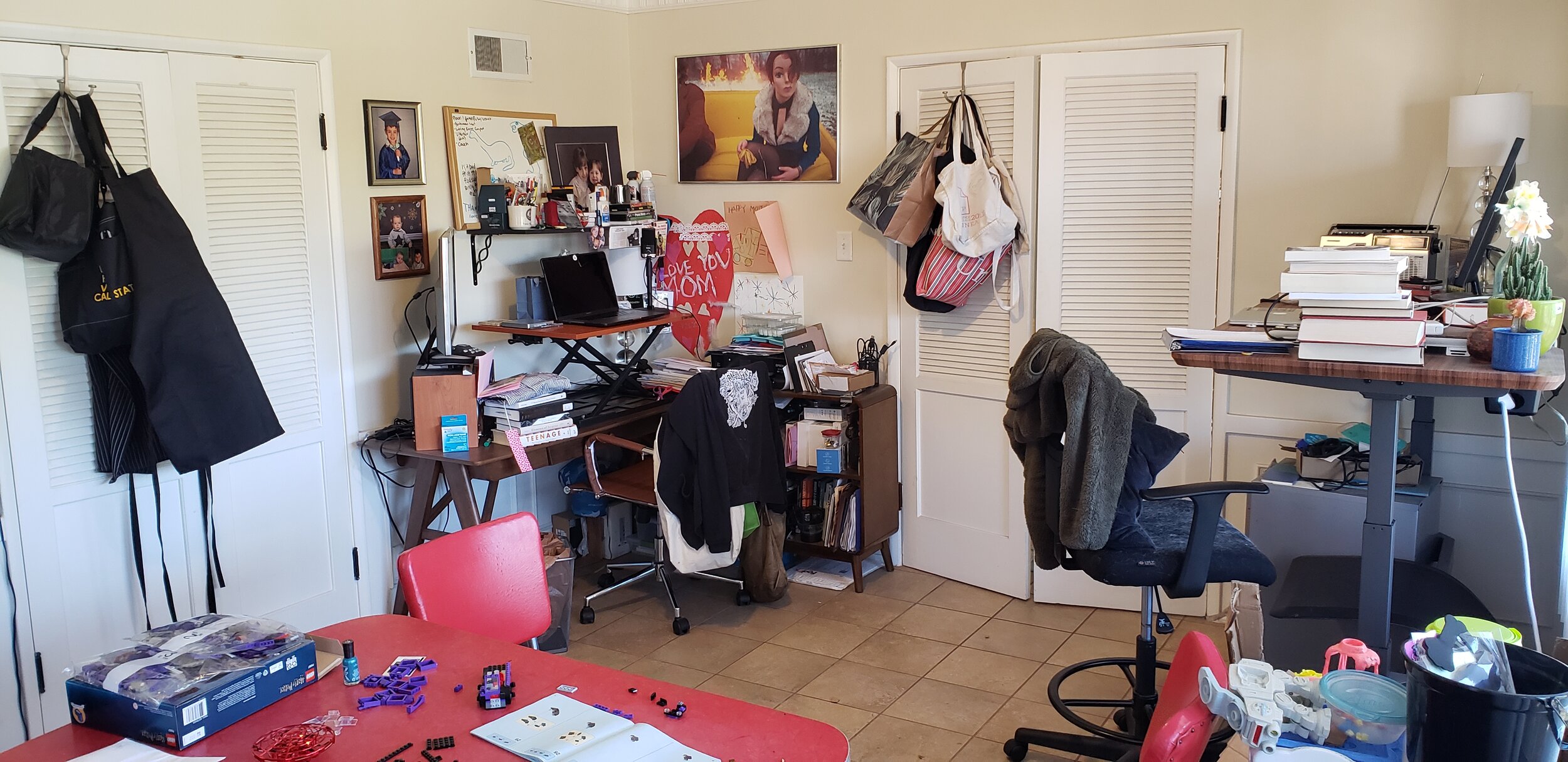 Image by Sharon A. Mooney of her dining room which now includes her teaching and work desk, the work space of her partner, and their child’s classroom:art space.jpg