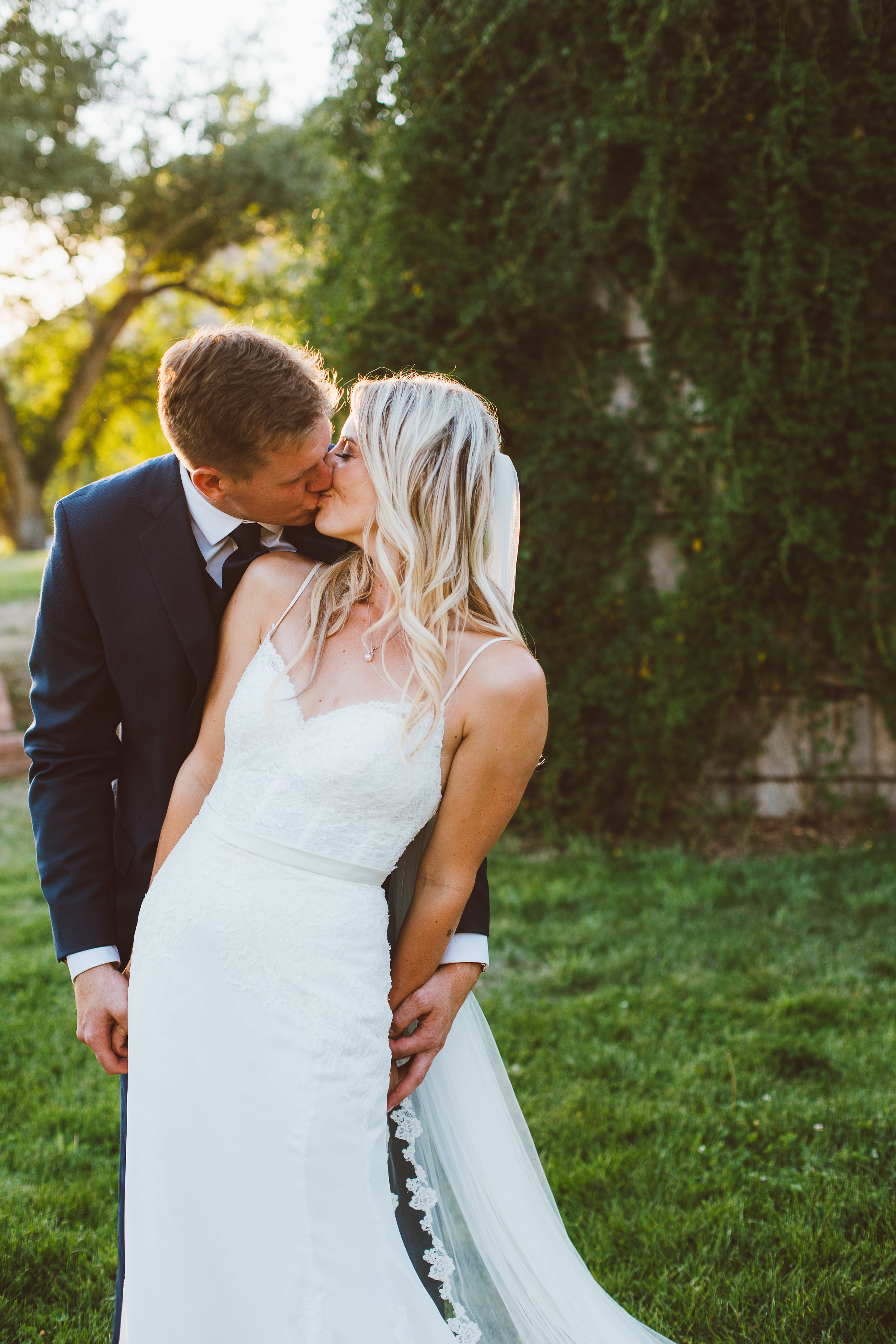 bride and groom kissing at wedding in Lyons, Colorado