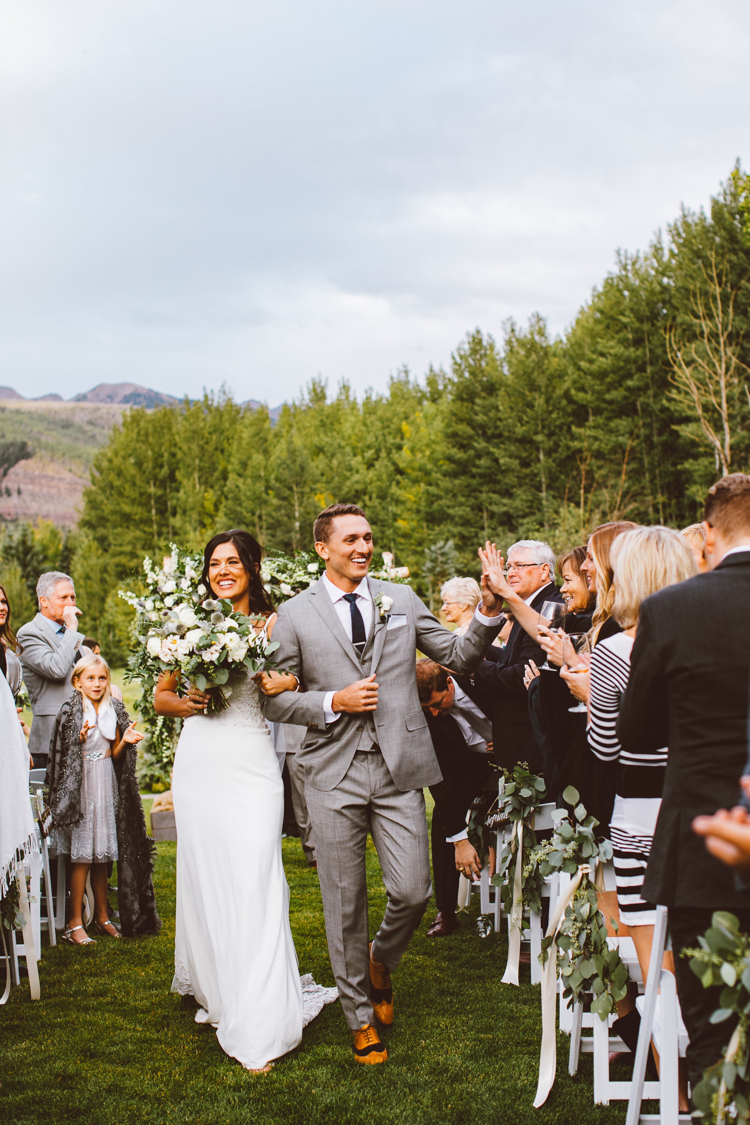 Bride and groom walking down the aisle in Vail Colorado
