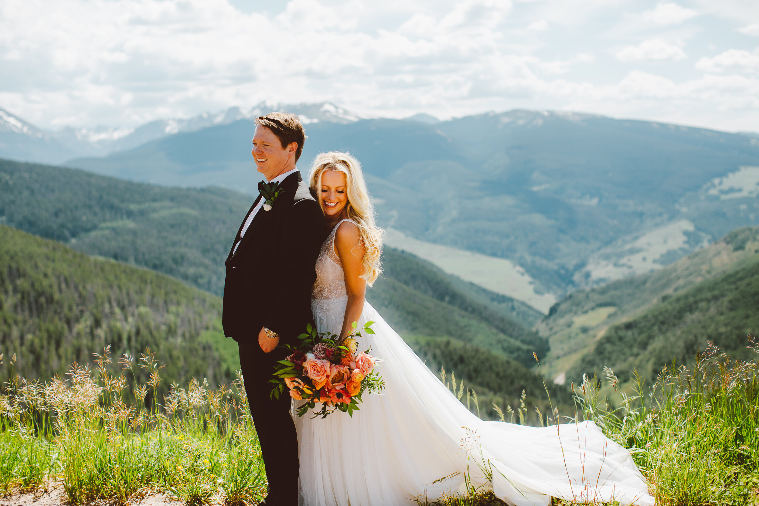 Bride and groom overlooking the Rocky Mountains in Vail Colorado