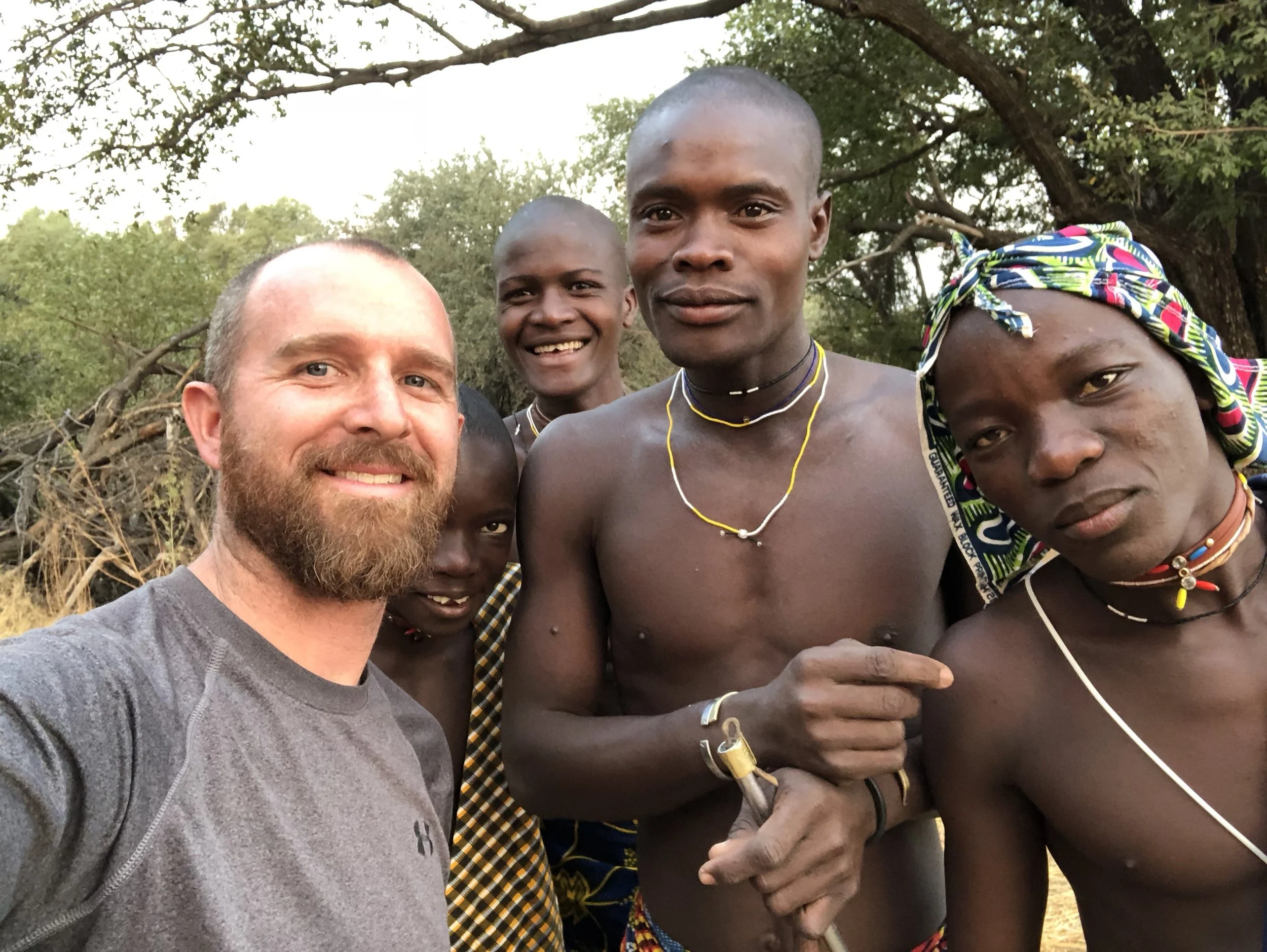 Jacob Schwertfeger with a nomadic tribe in Angola, known as the Mucabal tribe.