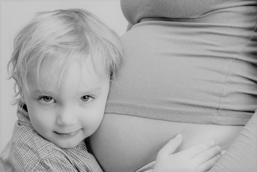 boy hugging bellyMedium smaller MERCURY(2).jpg