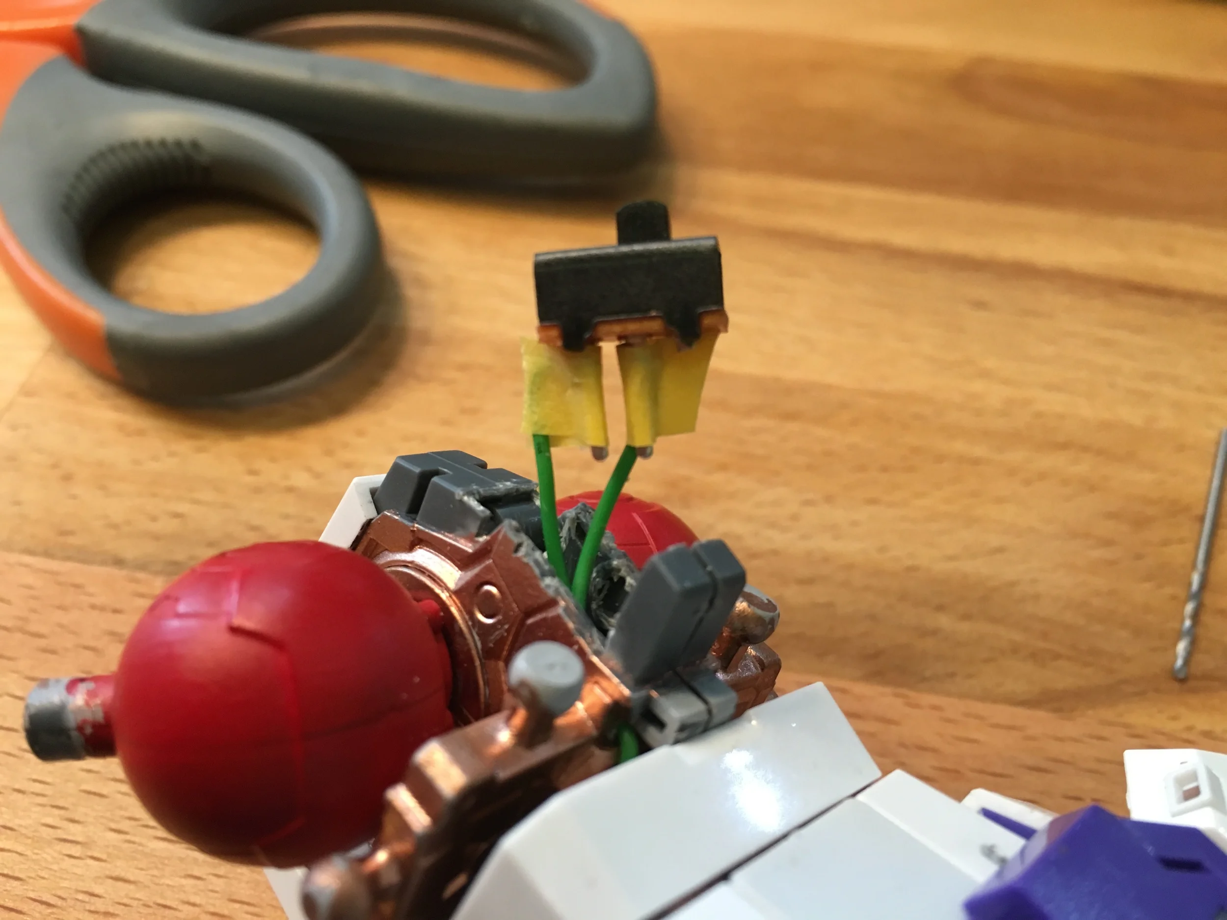 Back of lower torso. Wires run through the kit between the LED unit and this switch