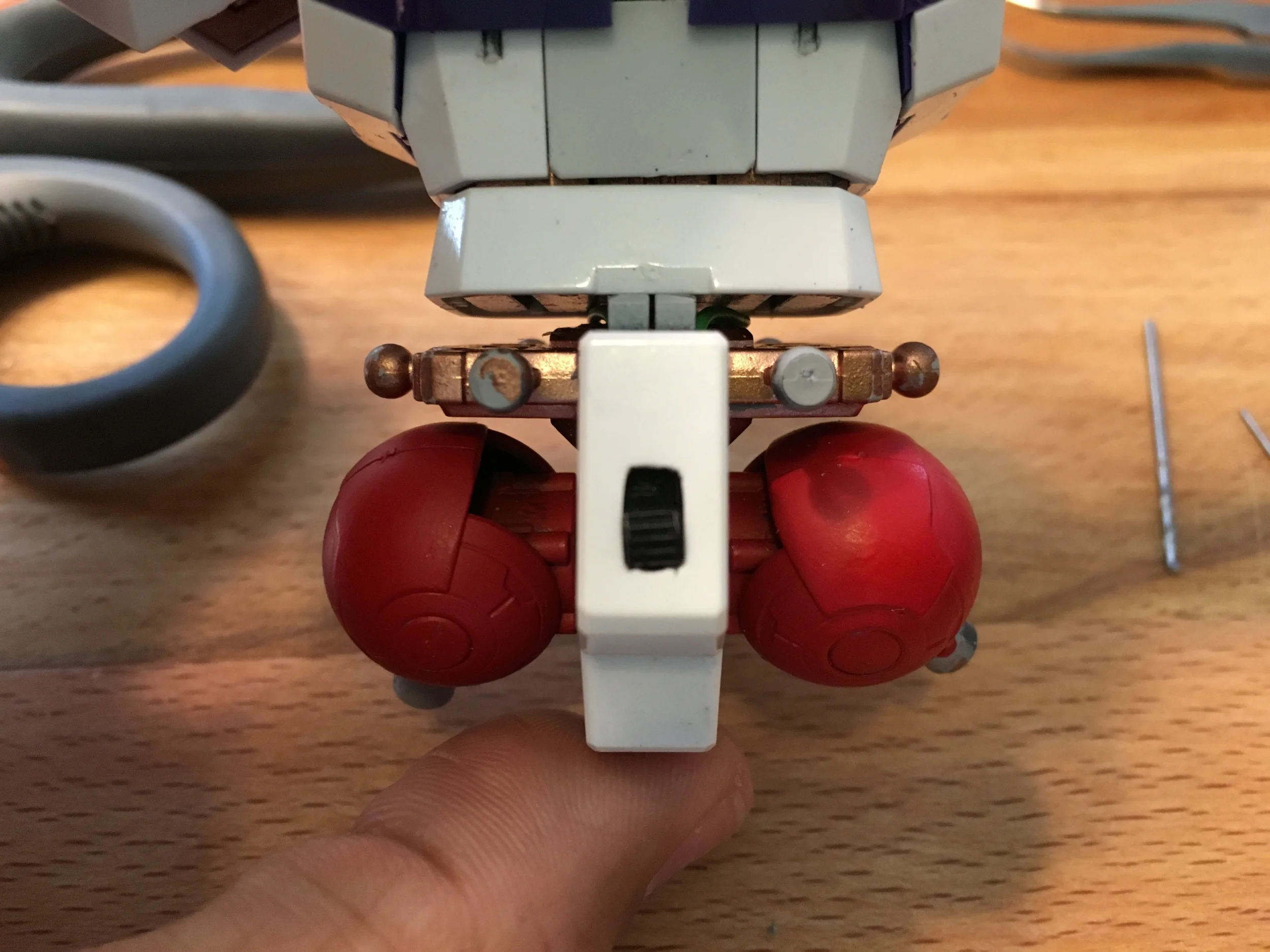Switch for the LED unit tucked away in the back of the torso